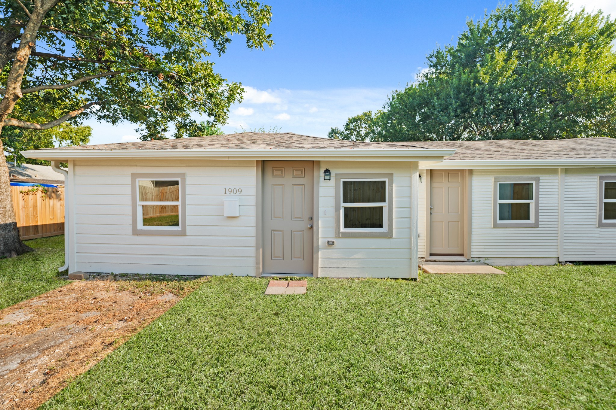 Front view. Two front doors. Door bell available.