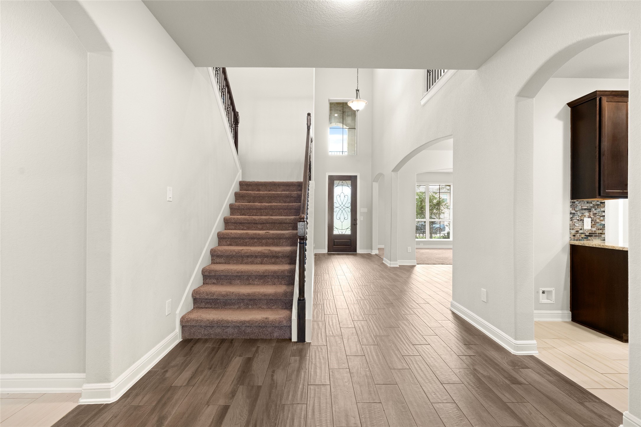 Elegant staircase with wrought-iron railing Elegant staircase with wrought-iron railing