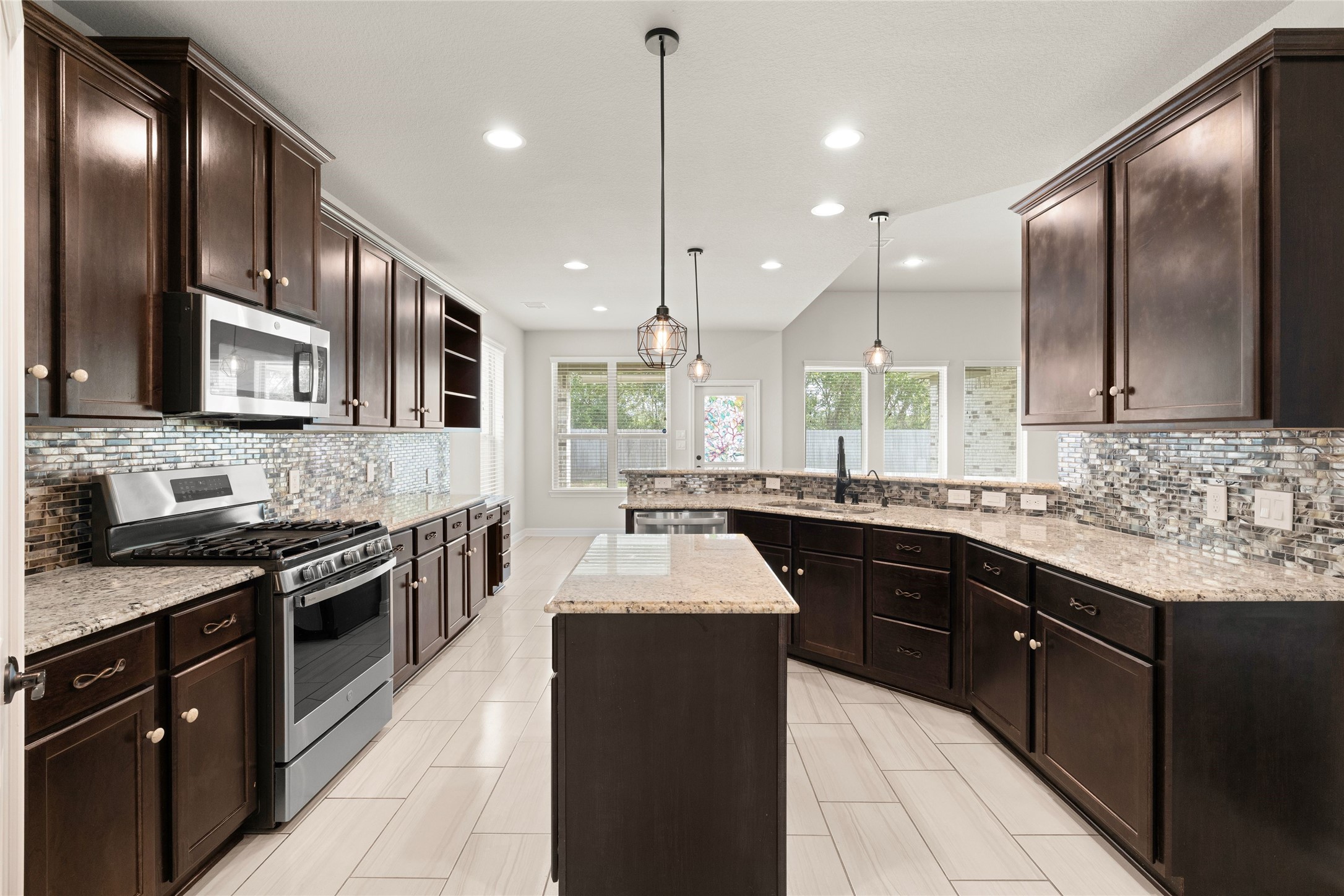 Gourmet kitchen with rich dark cabinetry
