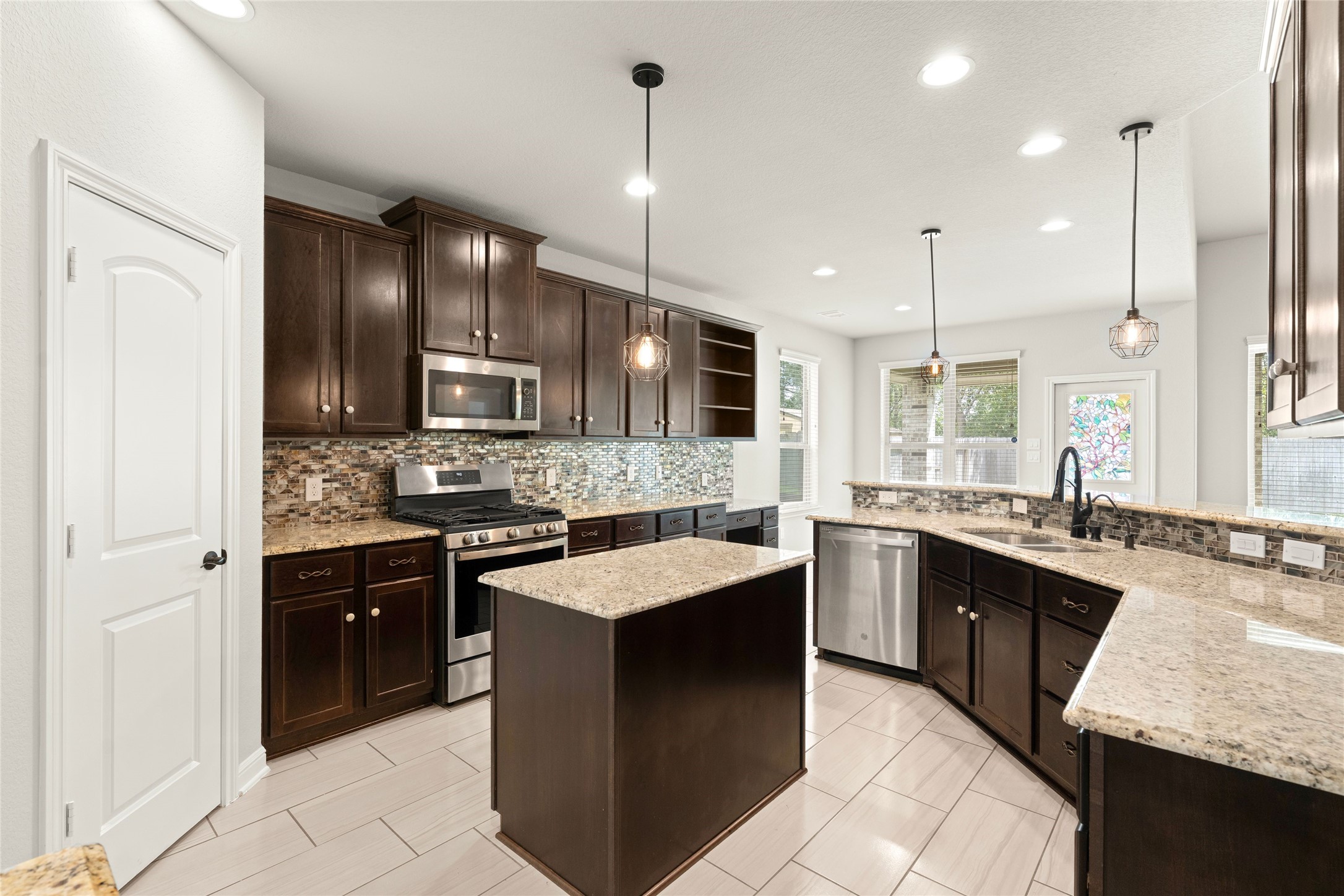 Open kitchen flowing into dining space