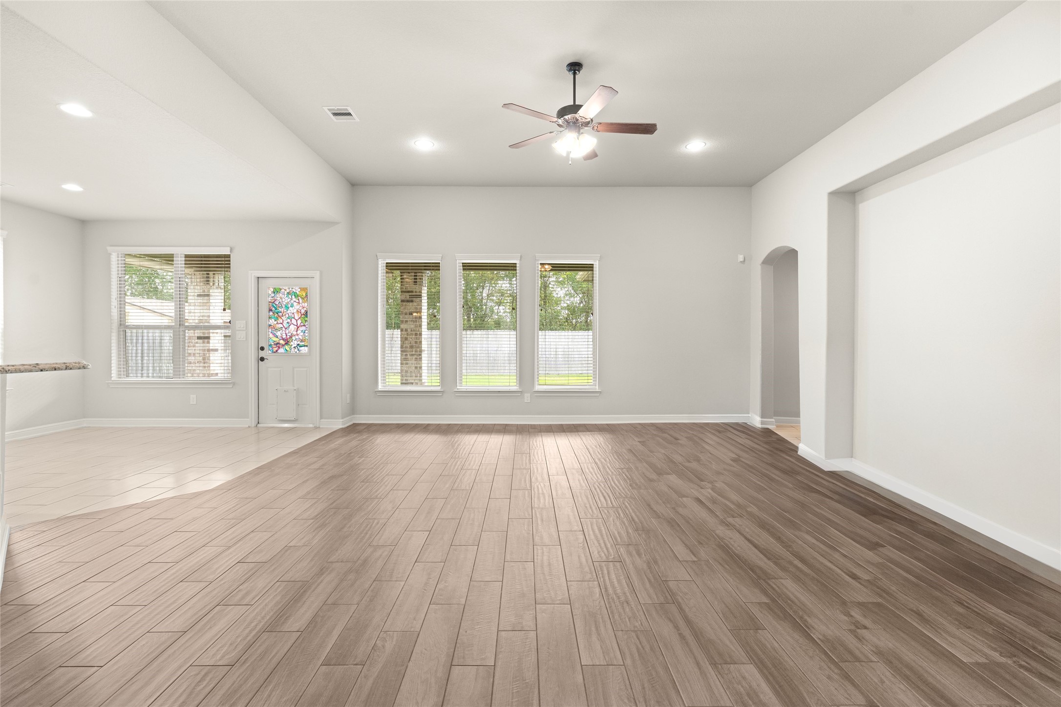Spacious living room with tons of natural light and attached breakfast room. Spacious living room with tons of natural light and attached breakfast room.