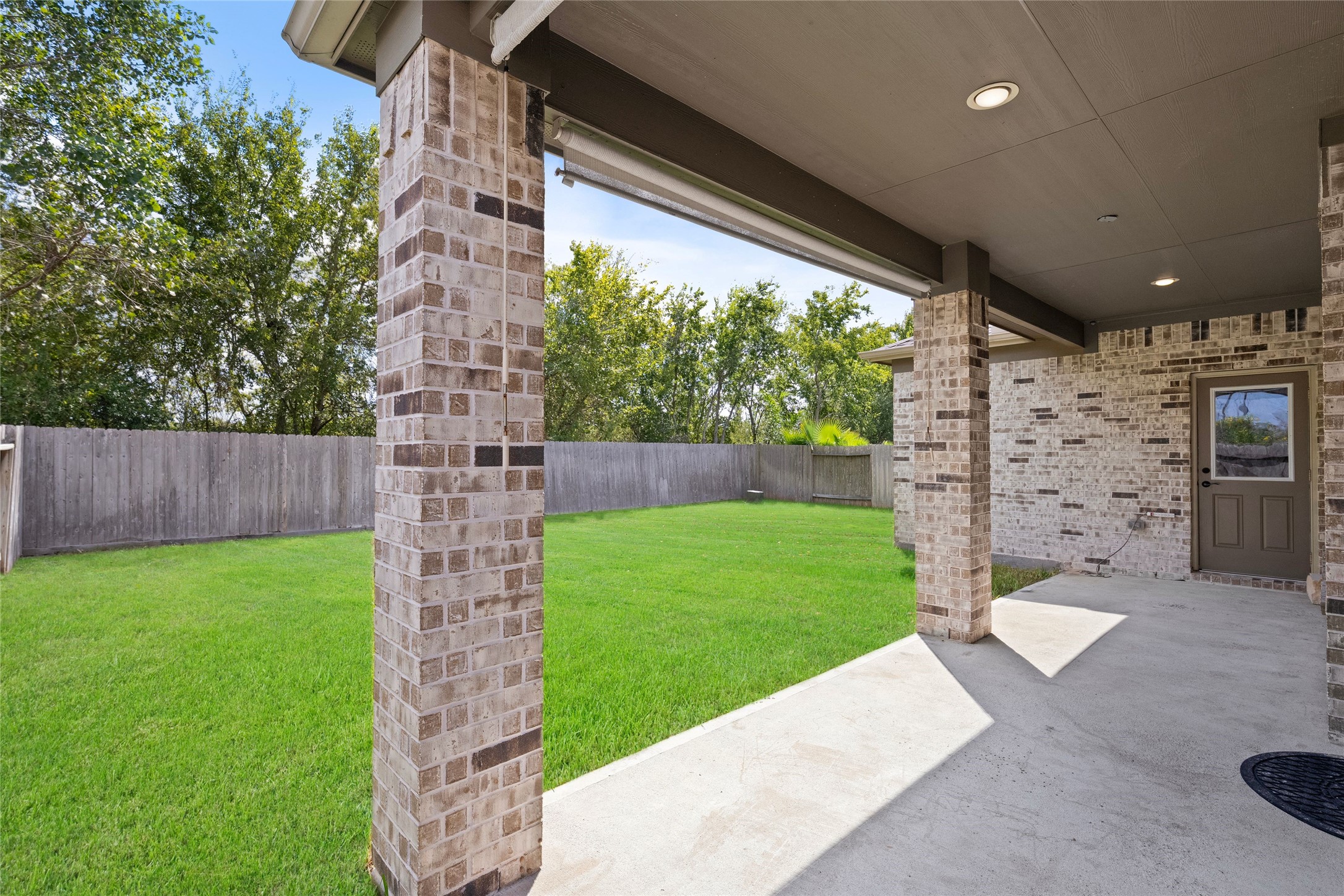 Covered patio overlooking the backyard