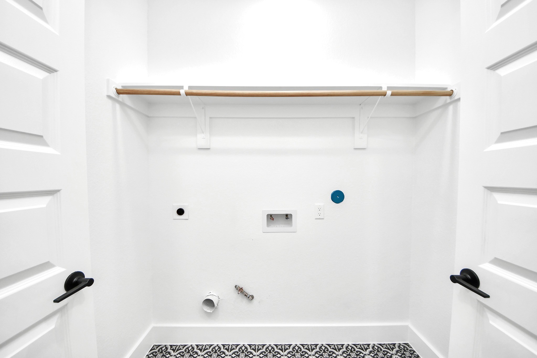 Unit Ds dedicated laundry area keeps household essentials accessible, efficient and neatly contained.
