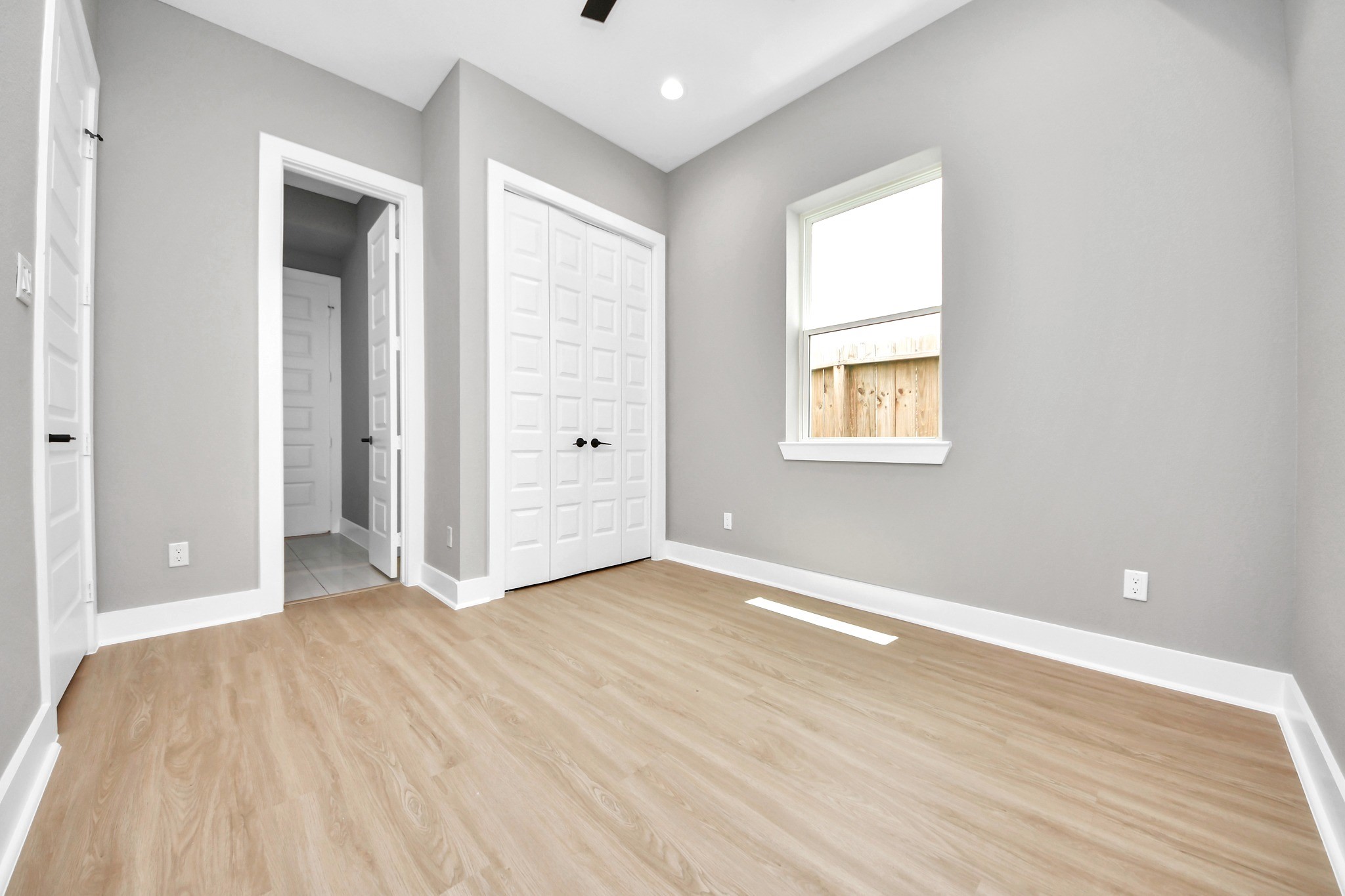 This bright secondary bedroom offers comfortable dimensions and an easy-to-furnish layout.