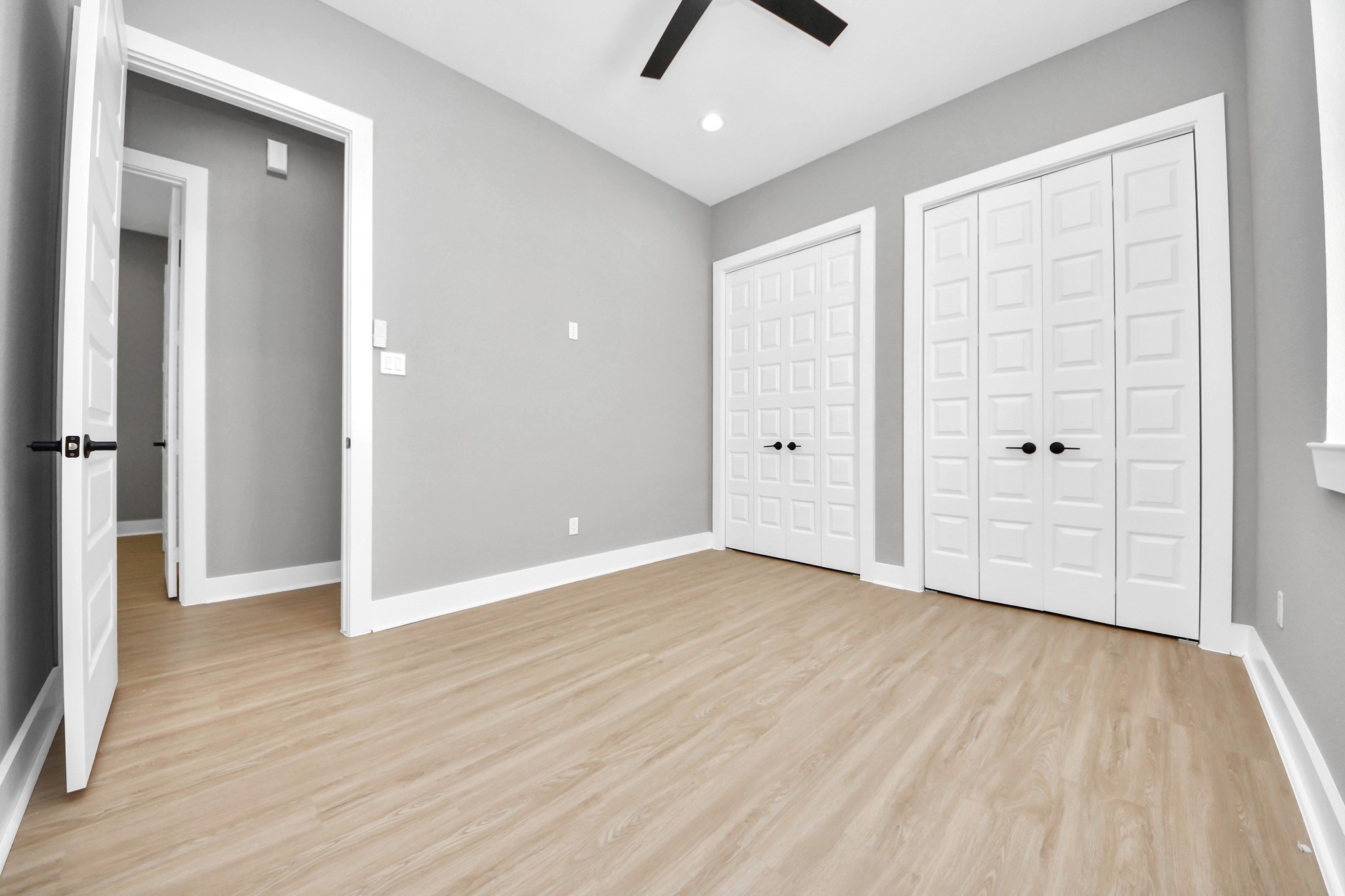 Another well-appointed secondary bedroom with clean finishes and ample space for sleeping, working or studying.
