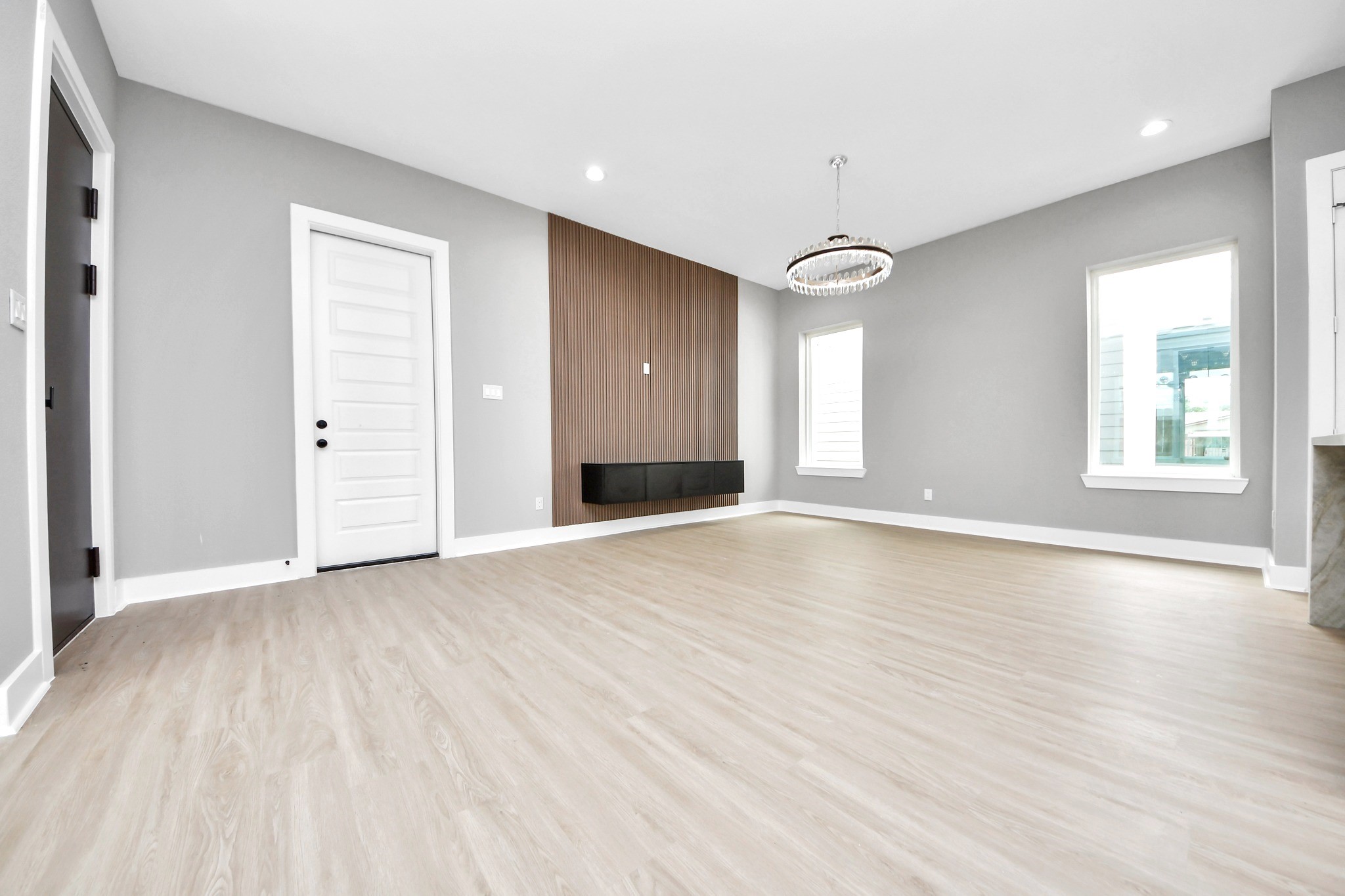The vacant view highlights Unit Ds true proportions, statement lighting, feature wall and bright open layout.