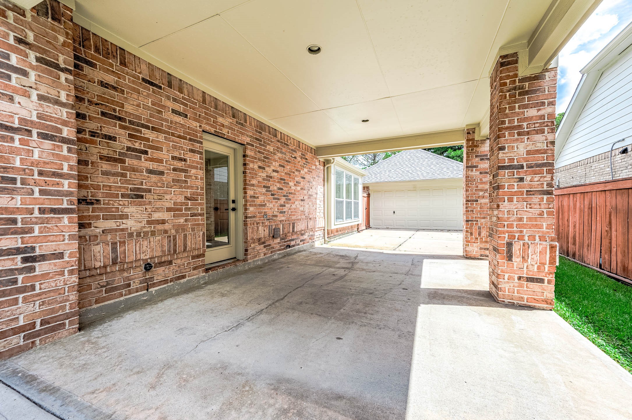 spacious outdoor carports that could be used for more car parking or other outdoor activities