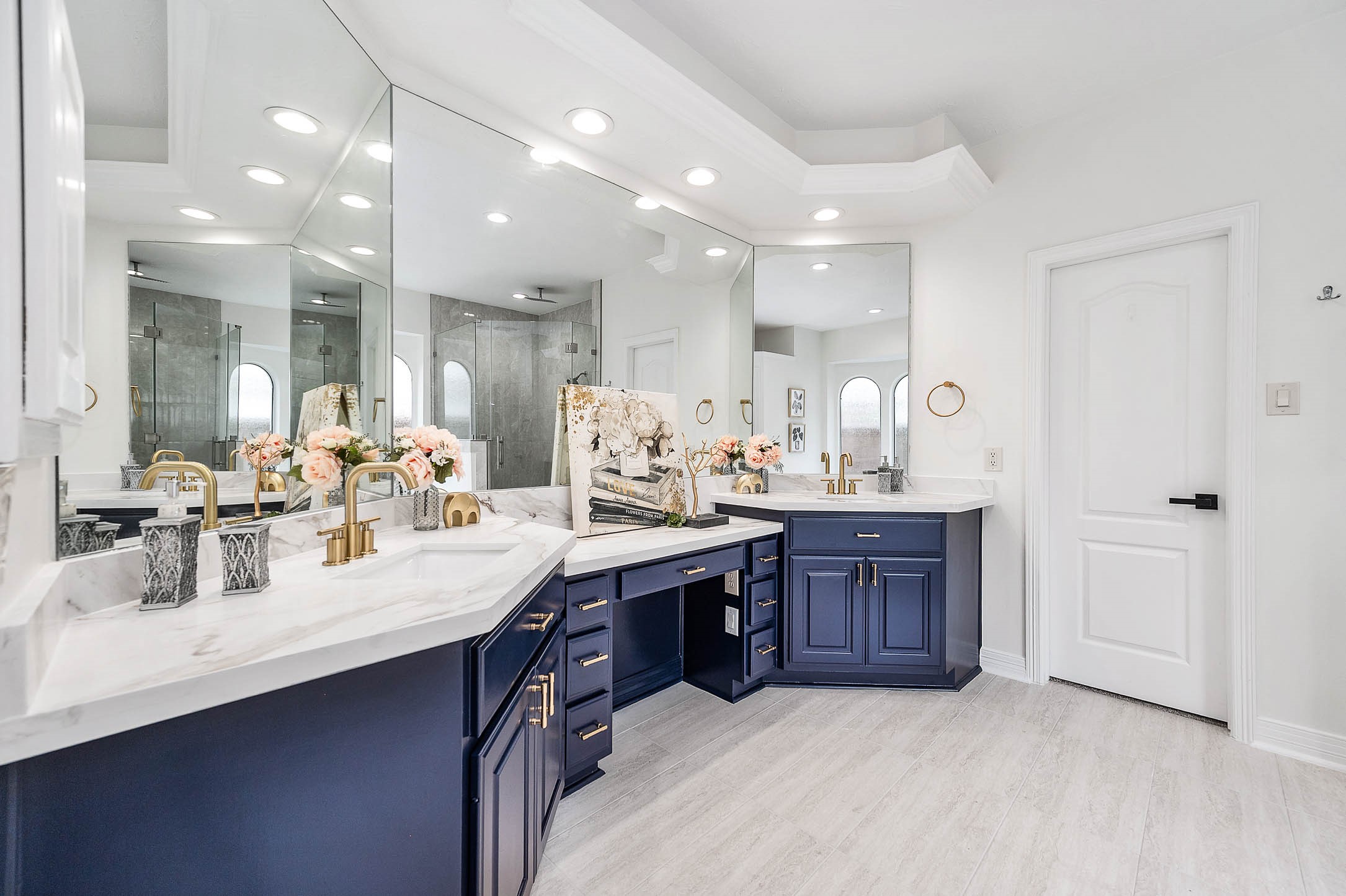 Primary bathroom was upgraded with new countertop, new tiles, new faucet and lighting fixtures, glass doors in standup shower etc.
