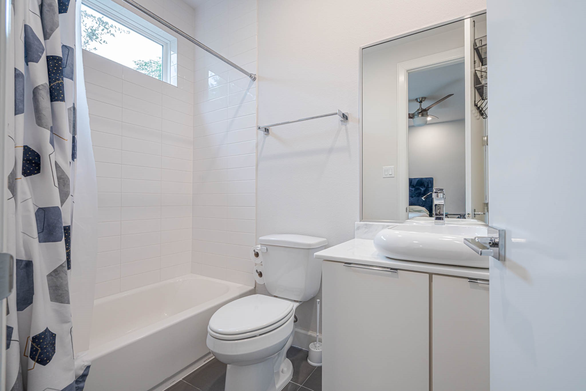 Experience modern comfort in this stylish 3rd floor full bathroom, featuring sleek fixtures, a chic vanity, and a refreshing bathtub for ultimate relaxation.
