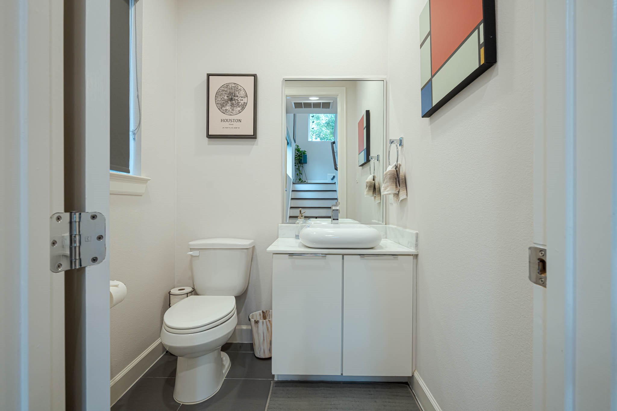 Stylish and convenient, this second-floor half bath features modern fixtures and sleek design, offering a perfect blend of functionality and elegance.