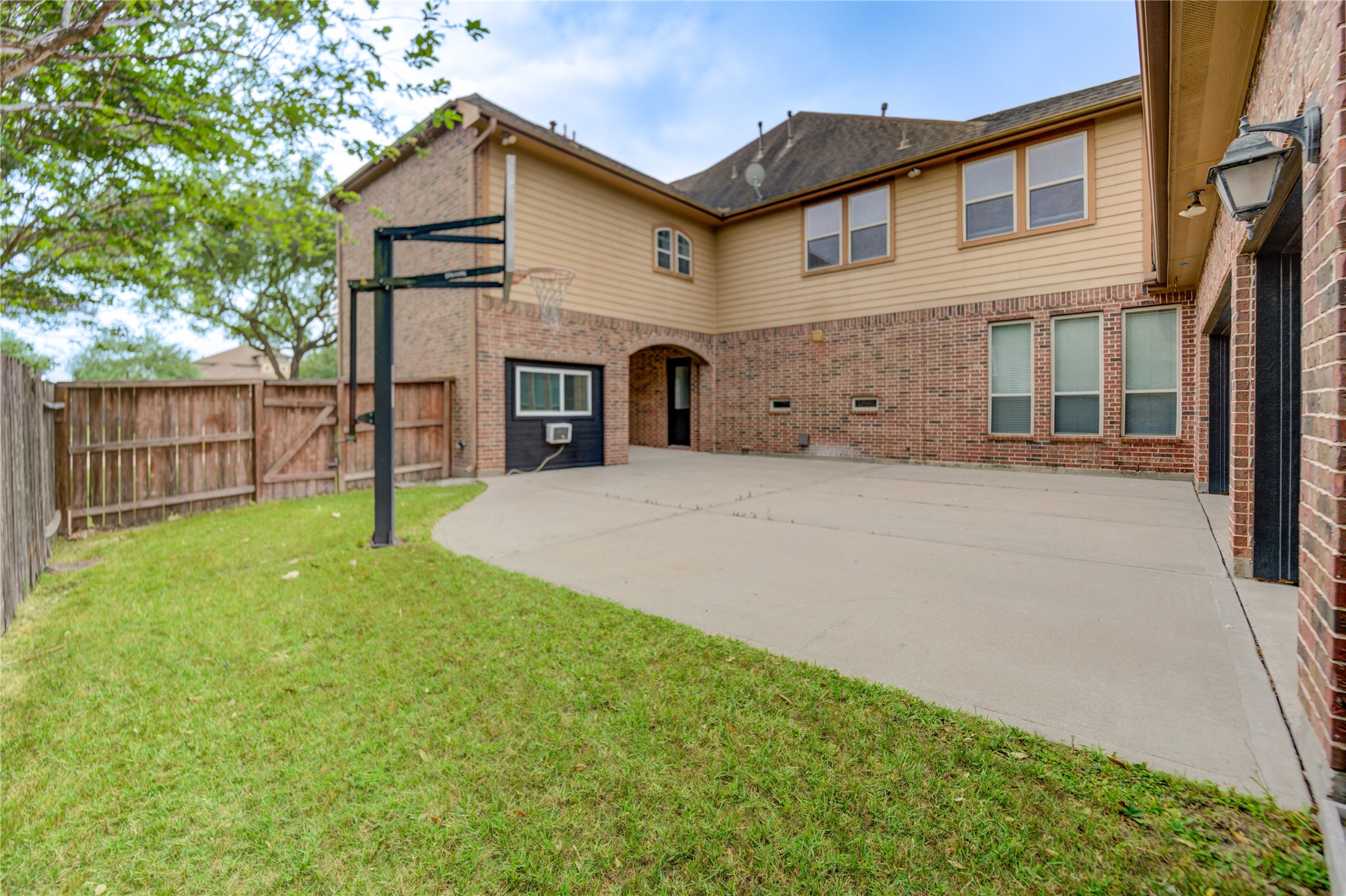 The gated driveway offers enhanced privacy and security.