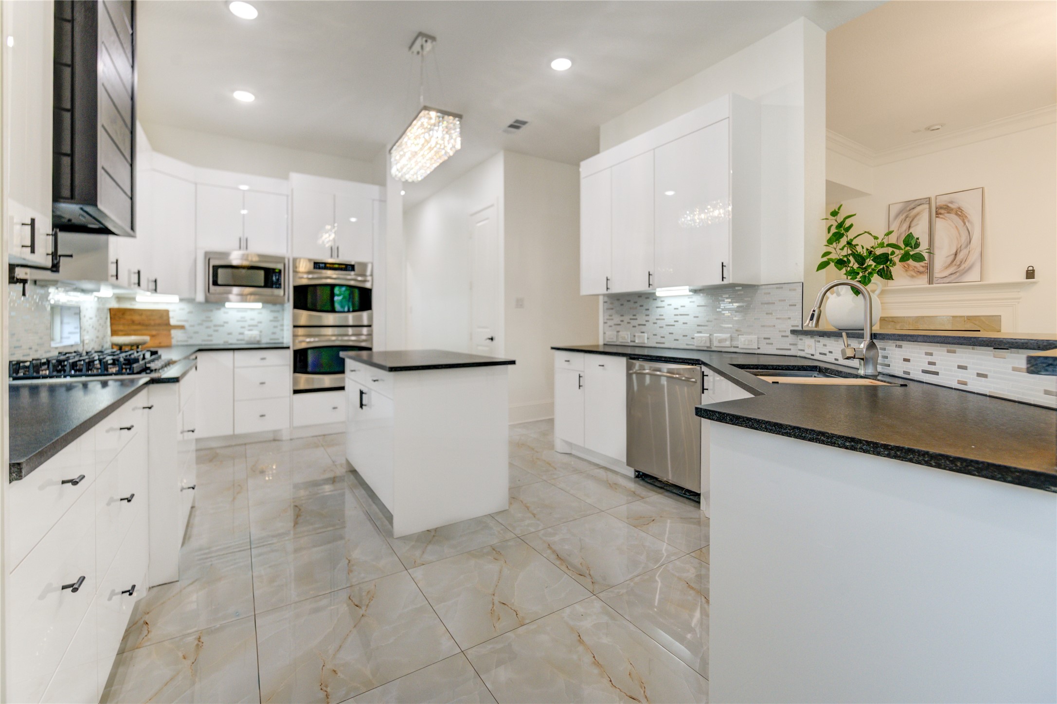 A stylish kitchen showcasing black leathered granite countertops. A stylish kitchen showcasing black leathered granite countertops.