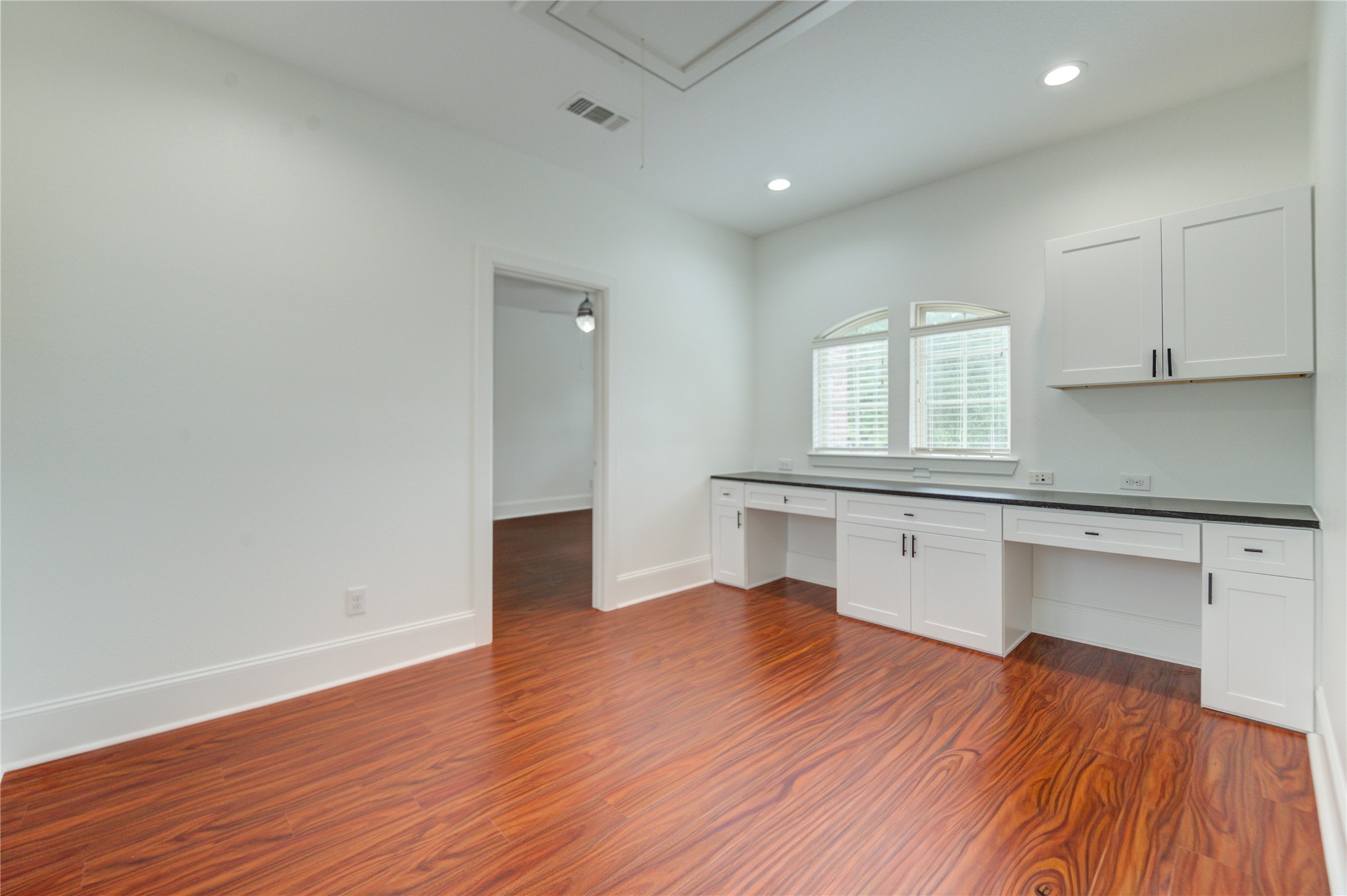 A thoughtfully designed built-in workspace upstairs, ideal for productivity and organization.