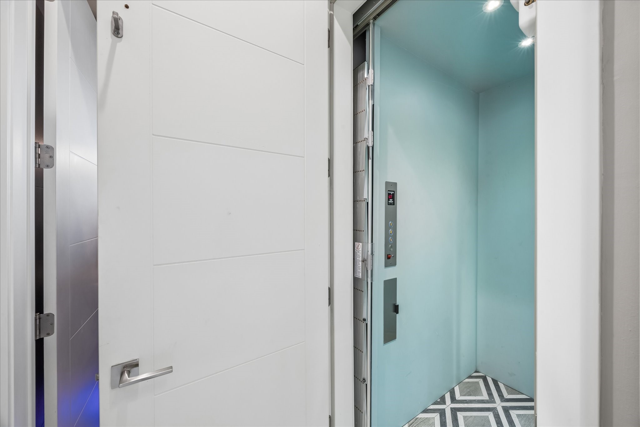 Convenient elevator access connects all levels of the home, ensuring ease and comfort throughout