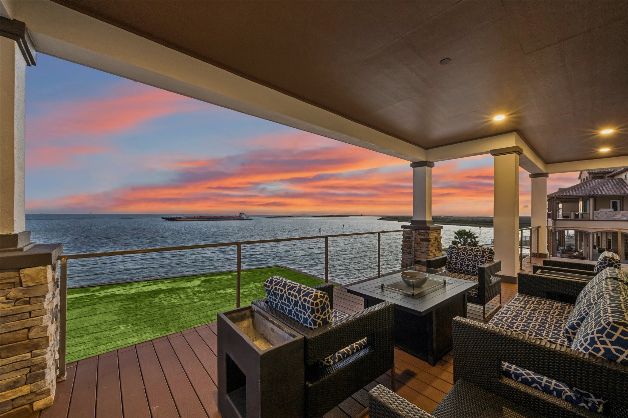 This view never gets old; whether entertaining guests or enjoying a twilight unwind, the bays serene panorama provides an unparalleled connection to coastal living