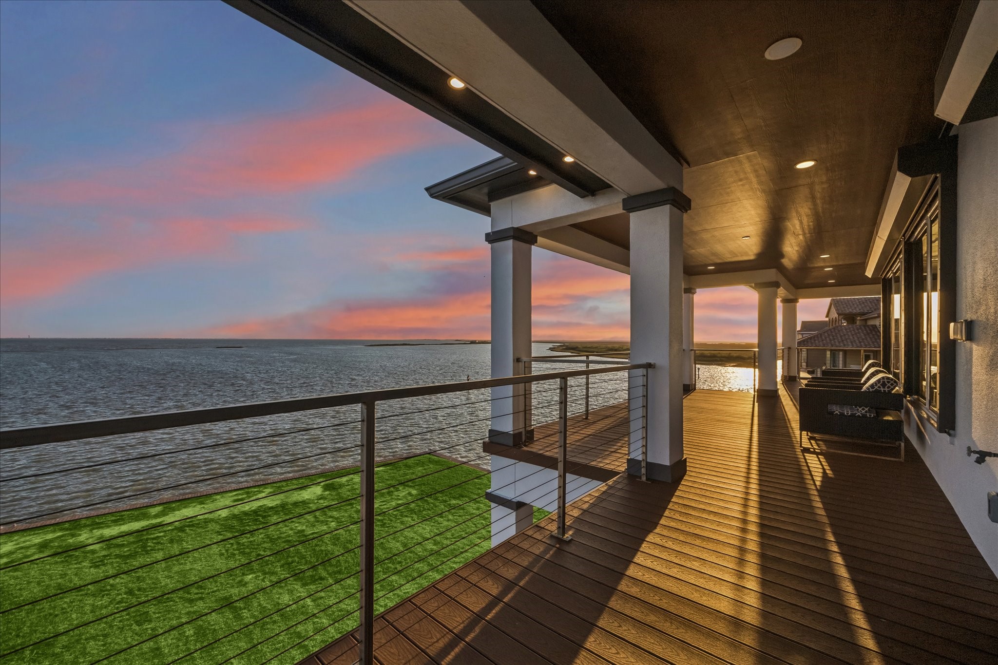 Capture unforgettable views from the second-level balcony, where the sunset paints the sky and reflects across the bay