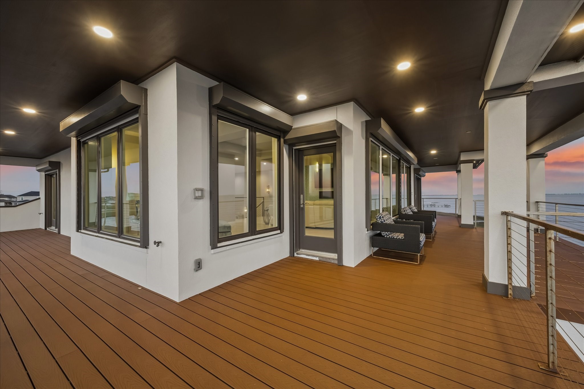This extraordinary balcony provides a seamless transition from the second-level living area to an incredible waterfront setting, with all windows outfitted with motorized storm shutters for both protection and privacy