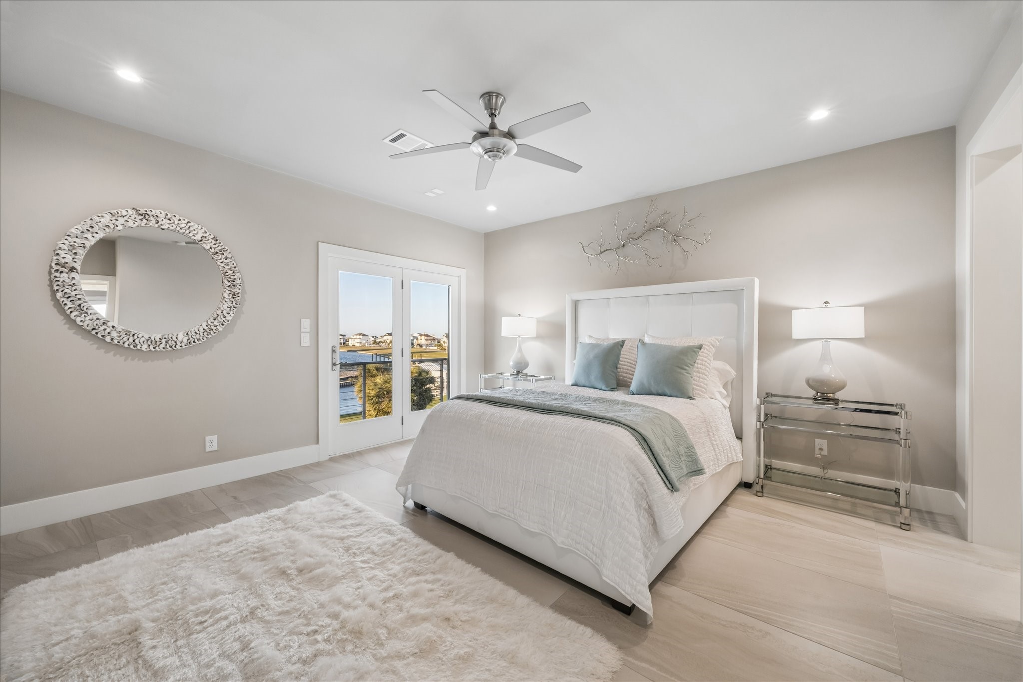 The second guest bedroom offers access to front balcony and a Jack & Jill bathroom