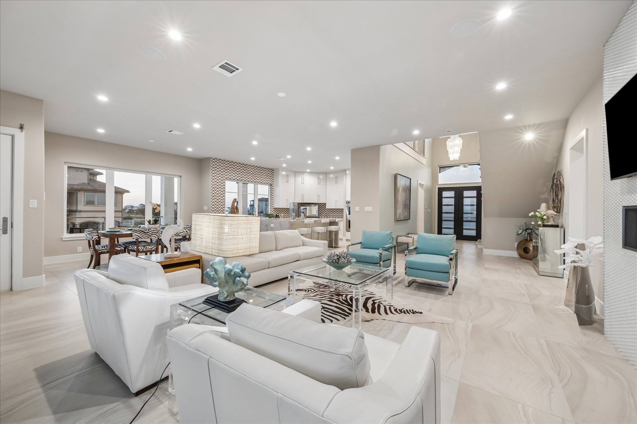 Open-concept layout seamlessly connects the kitchen, dining, and living areas for effortless flow and entertaining