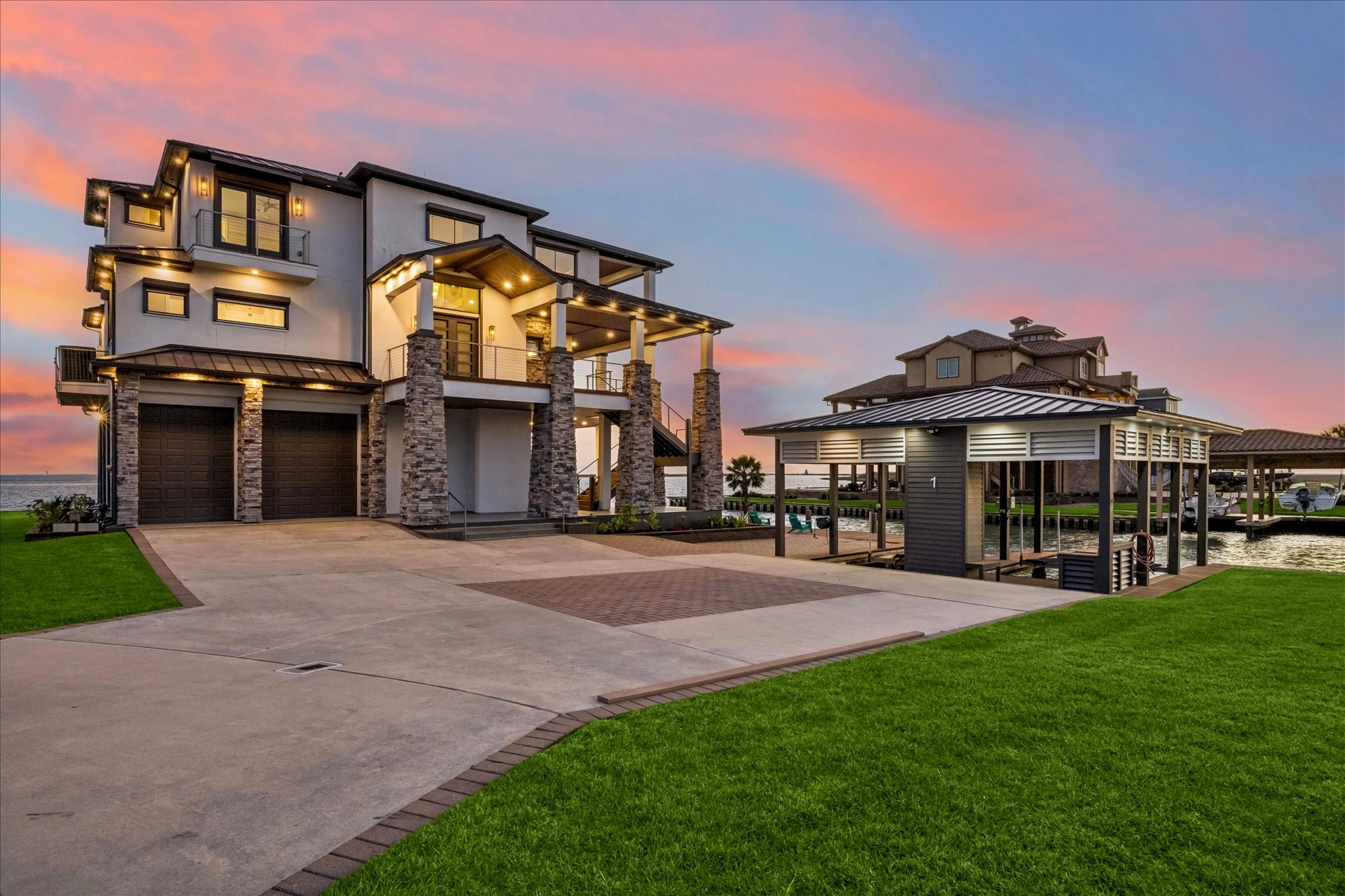 Experience coastal luxury in this TURNKEY - FULLY FURNISHED 4-bedroom, 3.5-bath architectural masterpiecea rare opportunity to own in this premier location within the exclusive gated enclave of Harborwalk on West Galveston Bay. This striking multi-level home blends modern design with effortless waterfront living, featuring clean lines, stone accents, and expansive glass showcasing breathtaking sunset views