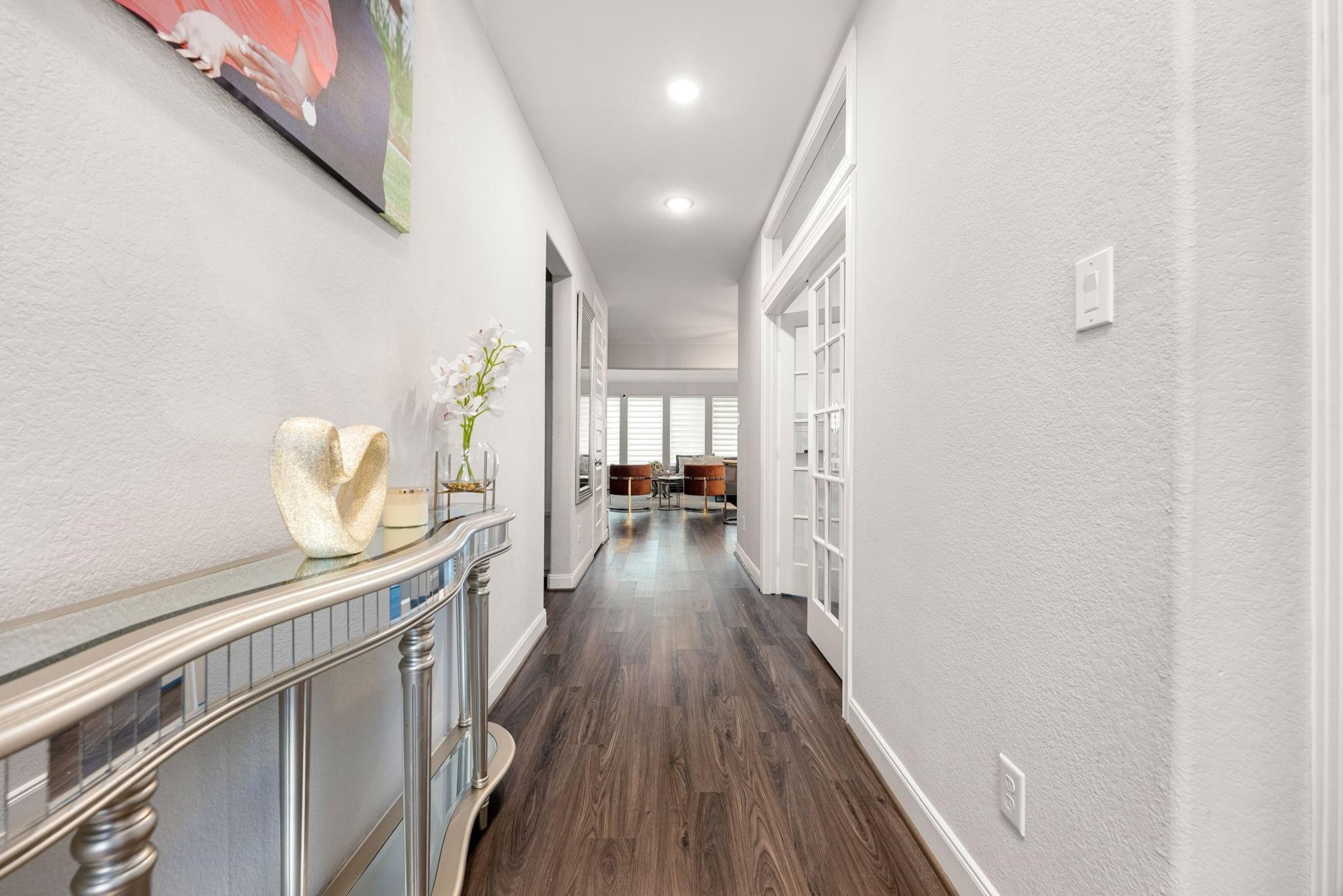 Step through the front door into a bright, open entry with a view into the main living spaces.