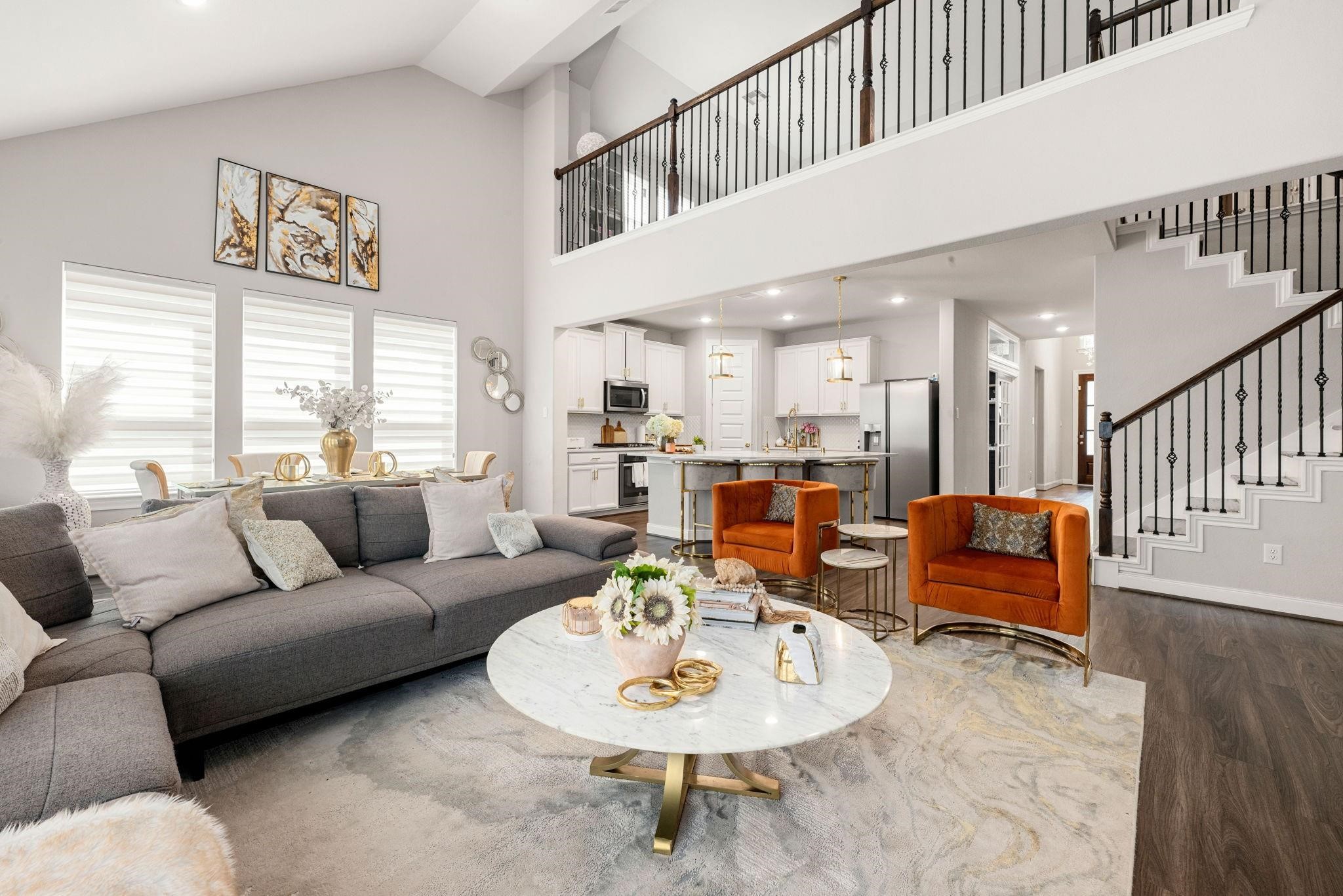 Vaulted ceilings and numerous windows fill the main living space with tons of natural light.