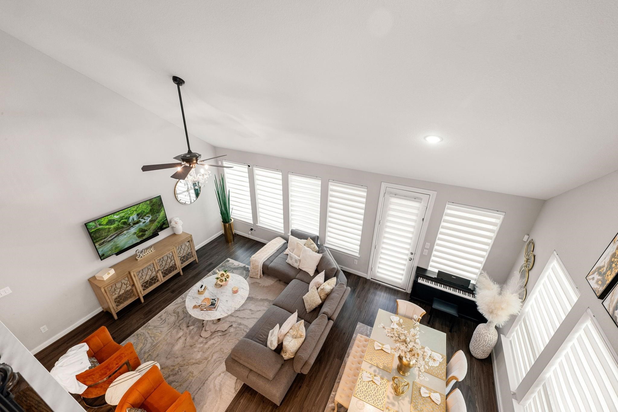 A view from the upper floor captures the open, airy feel of the living room below.