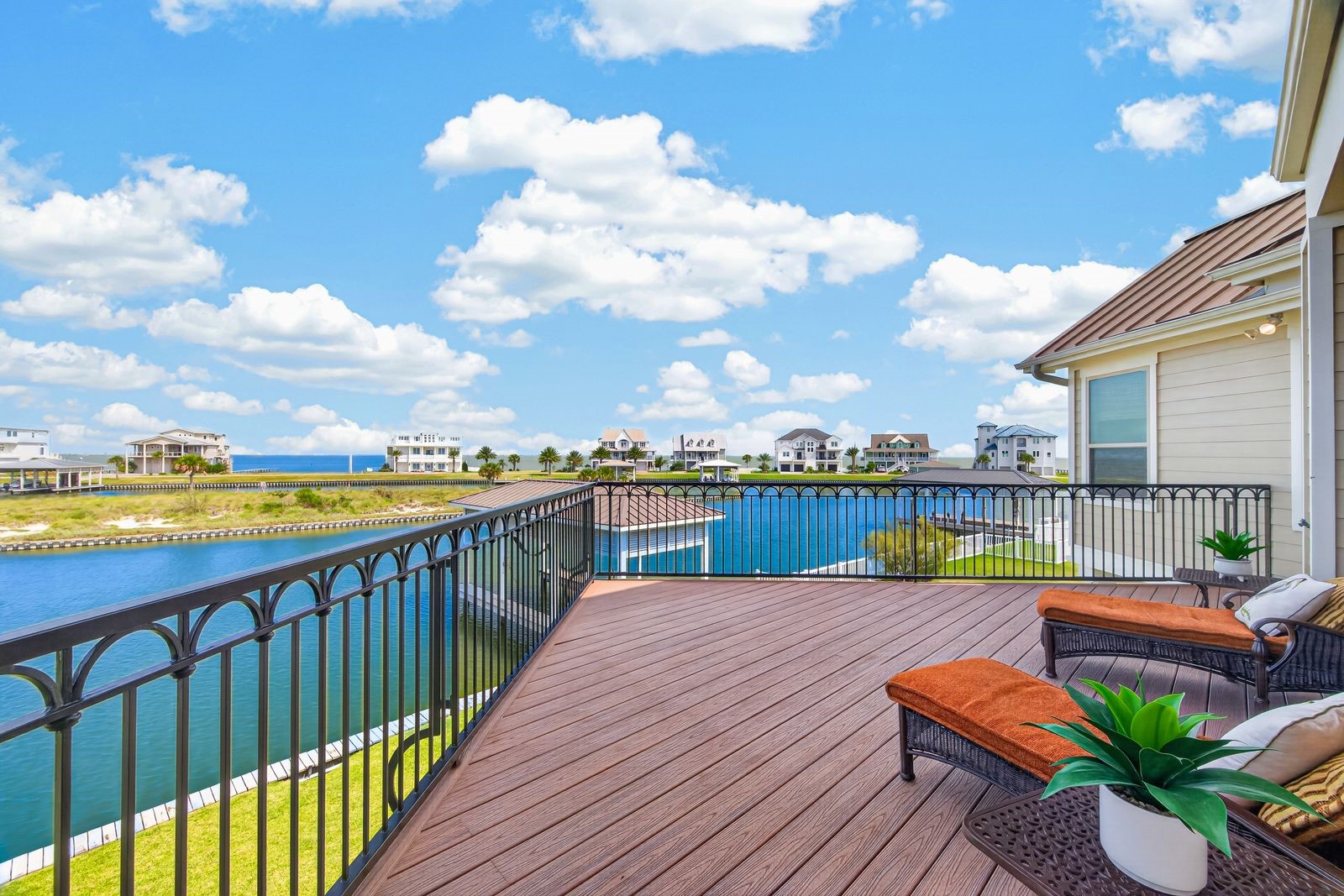 Expansive waterfront deck with stunning views, perfect for relaxing and enjoying the serene surroundings.