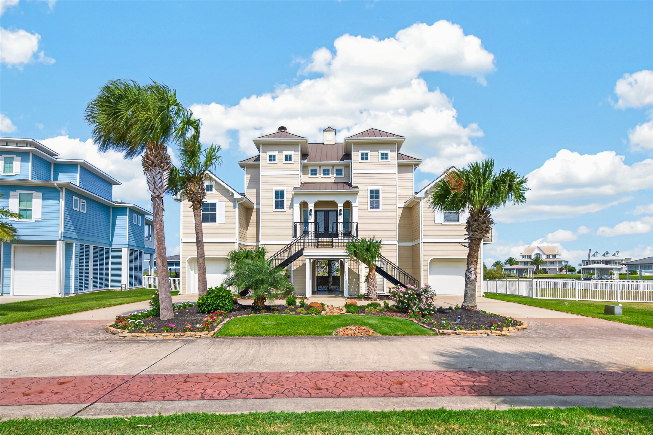 Stunning coastal home with elevated design, beautiful landscaping, and charming architectural features, perfect for seaside living.