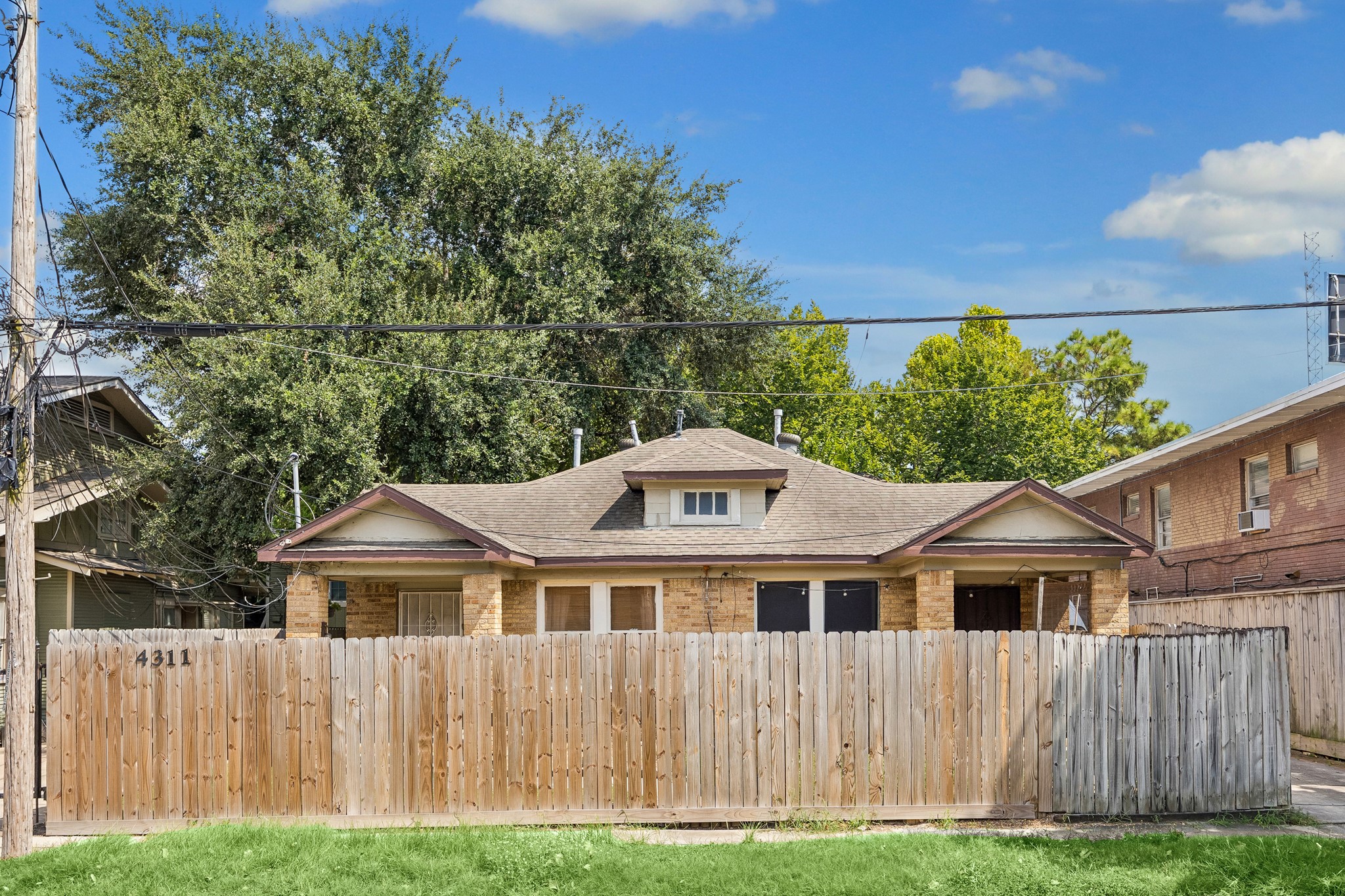 A view from the street showcases the privacy fence.