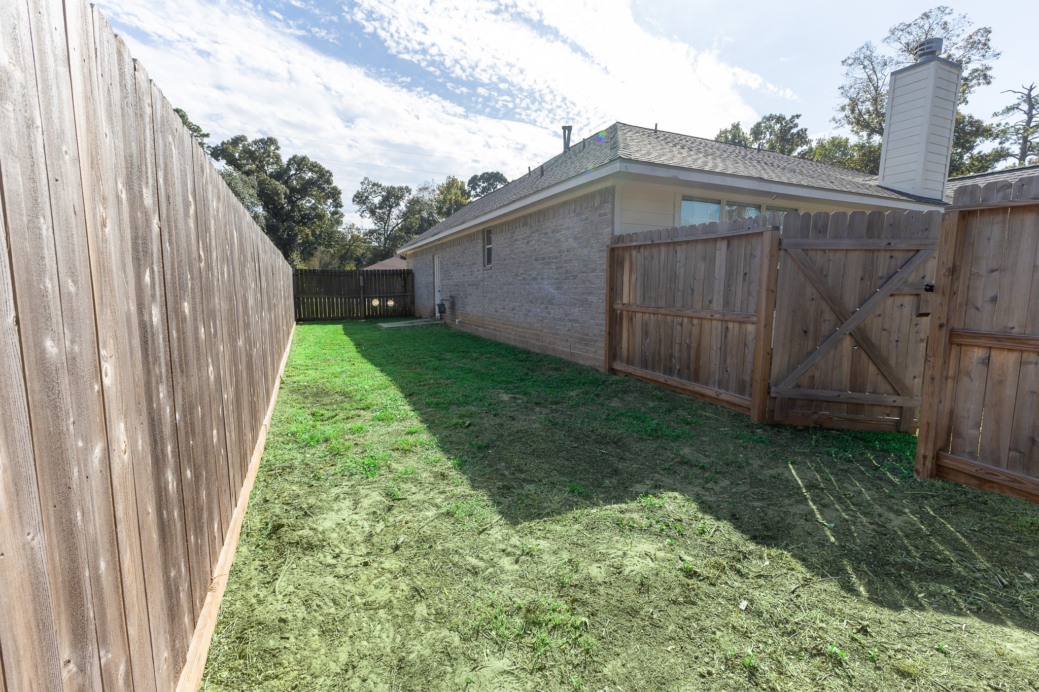 Spacious, fully fenced side yard with convenient gated access offers extra privacy and plenty of room for pets to roam and play! A wonderful bonus outdoor space with added flexibility and functionality.