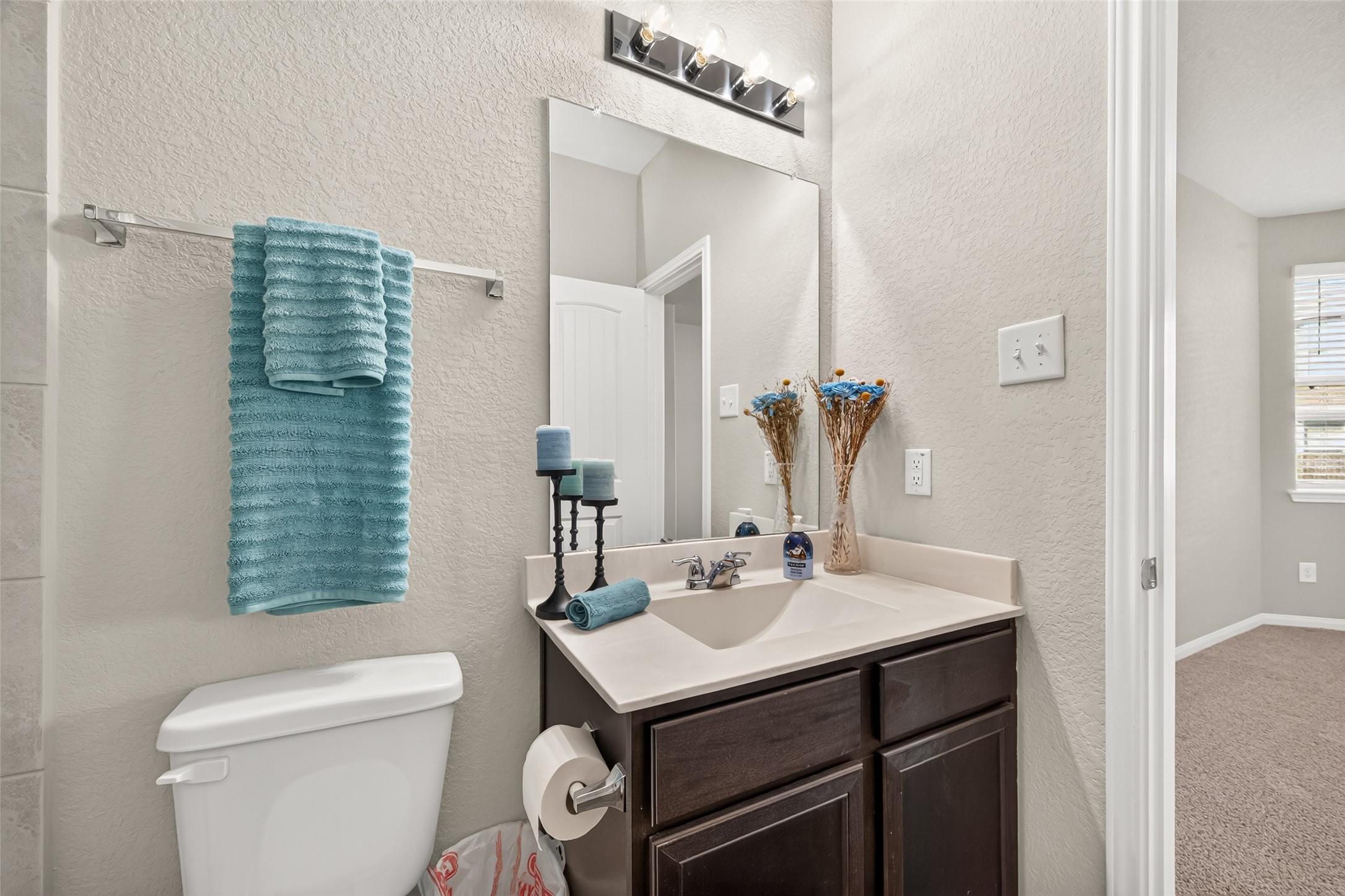 Charming bathroom with a sleek vanity and modern fixtures.