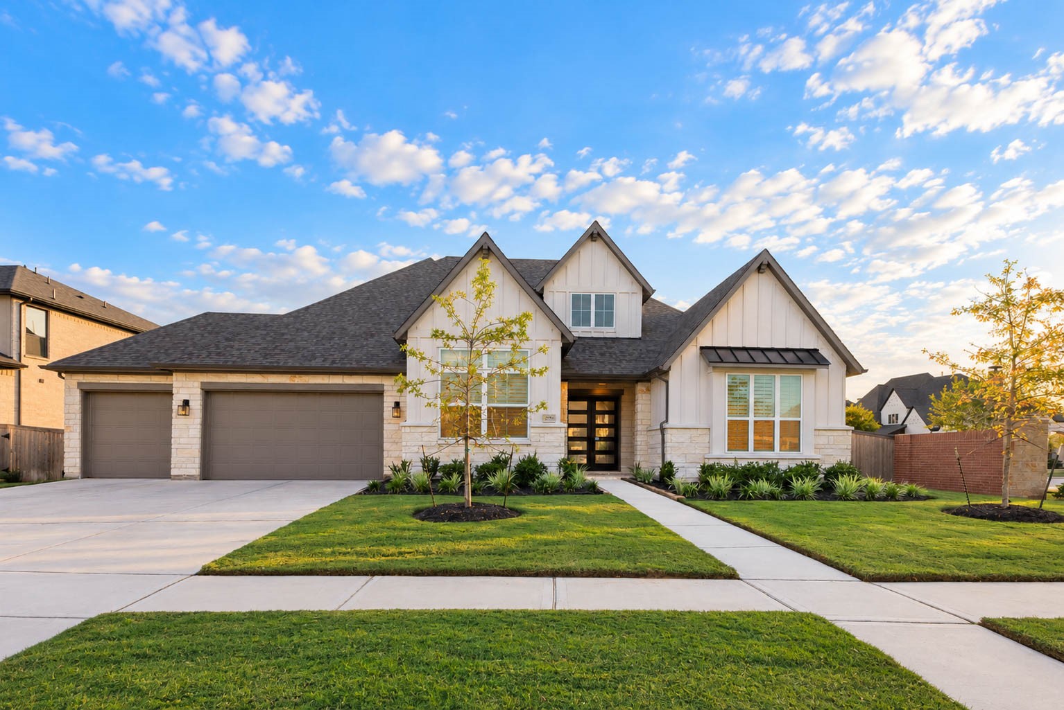 Stunning modern farmhouse with a charming gabled roof, spacious three-car garage, and beautifully manicured landscaping. Stunning modern farmhouse with a charming gabled roof, spacious three-car garage, and beautifully manicured landscaping.