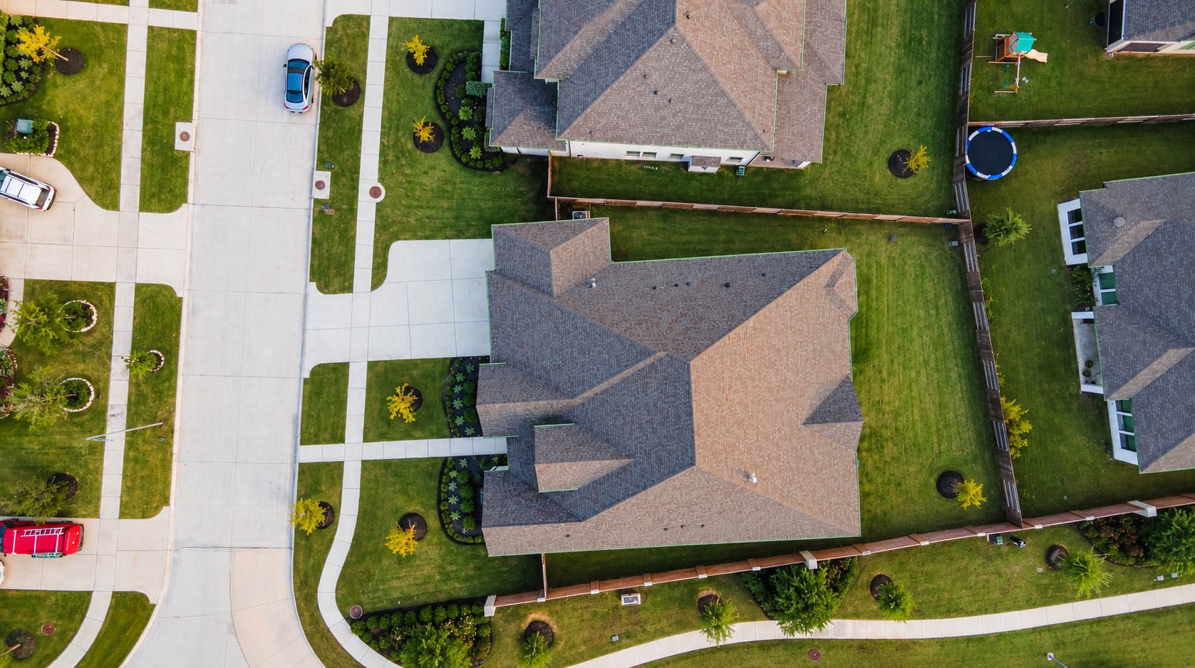 Nestled in a serene neighborhood, this spacious property boasts a beautifully manicured lawn and ample outdoor space, perfect for family activities and relaxation.