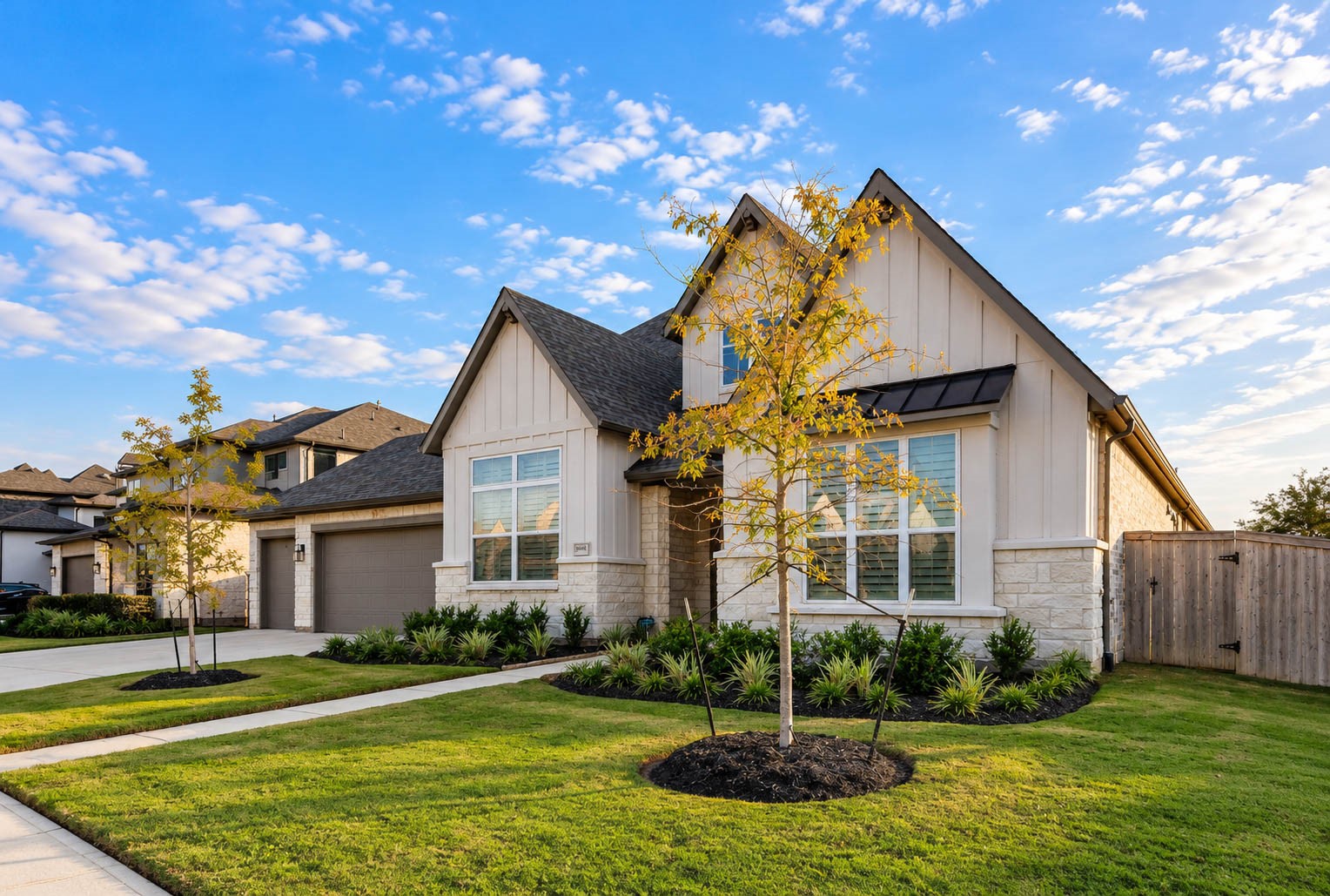 Charming modern home with a stone and stucco exterior, featuring a well-manicured lawn and inviting curb appeal. Charming modern home with a stone and stucco exterior, featuring a well-manicured lawn and inviting curb appeal.
