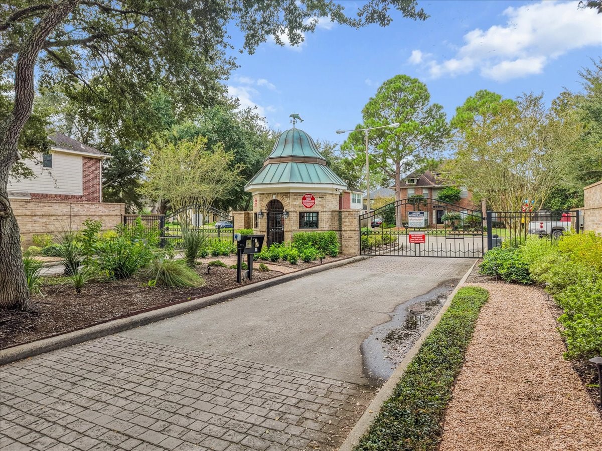 The Lakefront Preserve is a gated community with controlled access and a lovely tree-lined entrance.