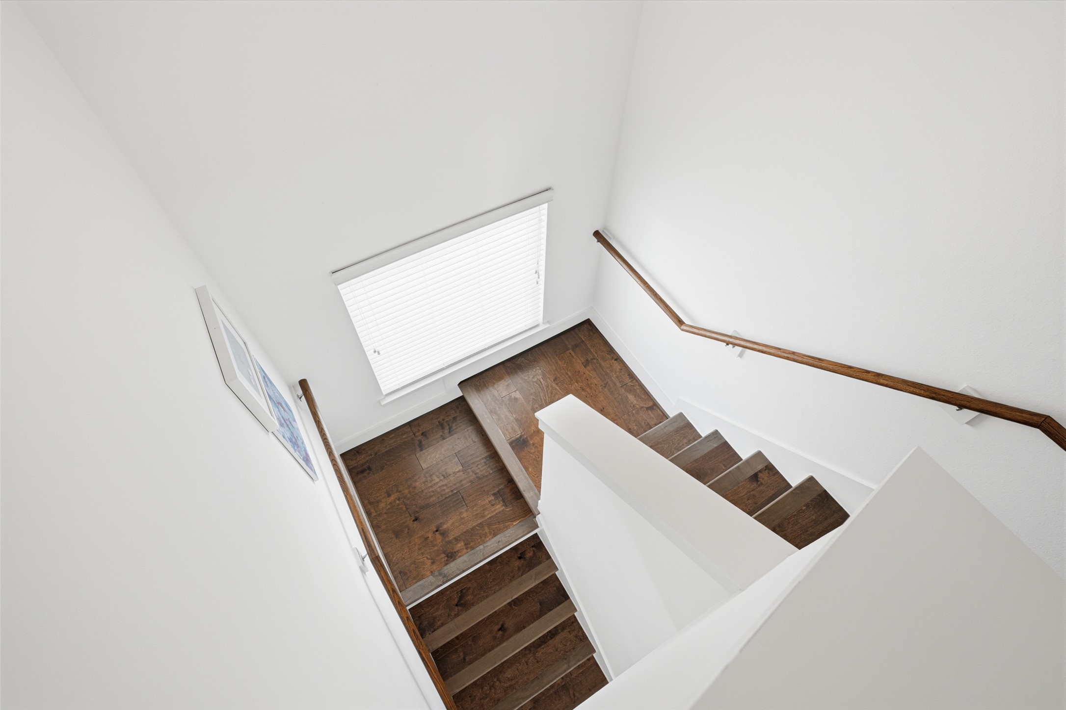 Engineered hardwood flooring continues up to the entire second floor.