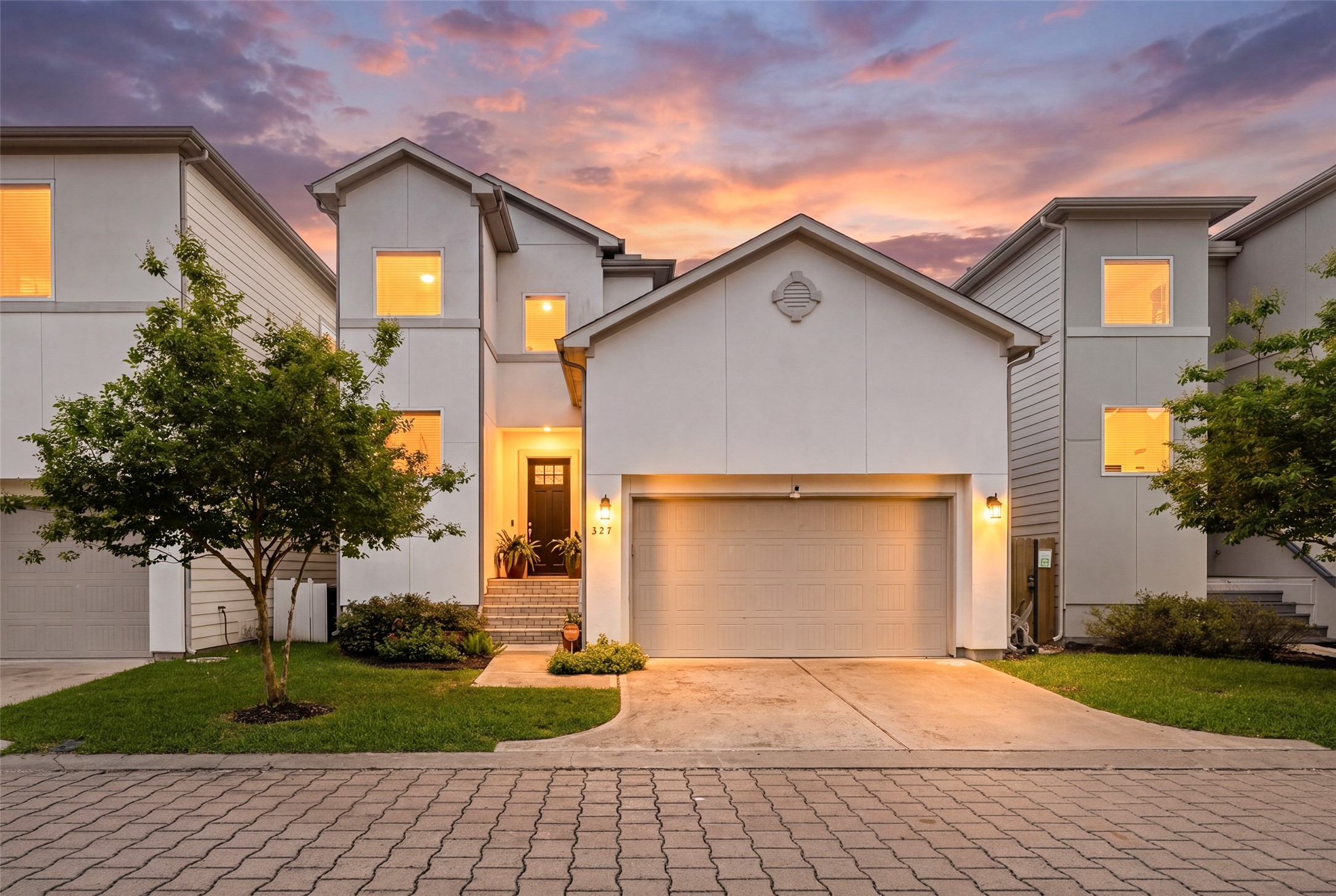 Welcome to 327 Yale Oaks Lane, a 2 story modern home in a White Oak Gardens, a newer gated community.