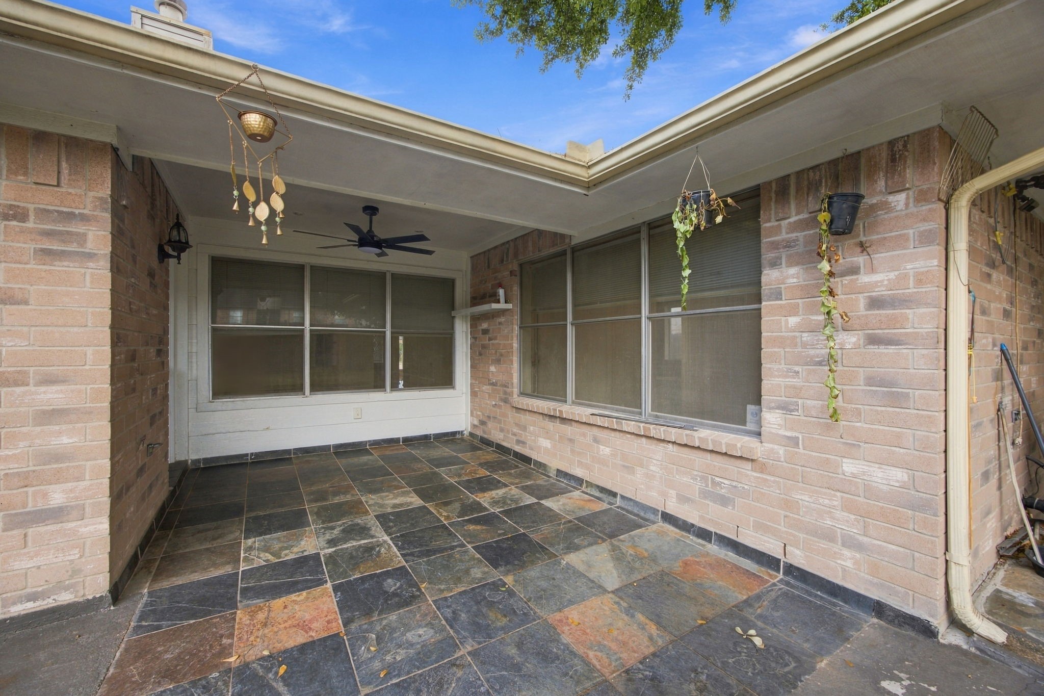 Tucked along the rear of the home, the patio offers a comfortable setting for morning coffee or relaxing outdoors.