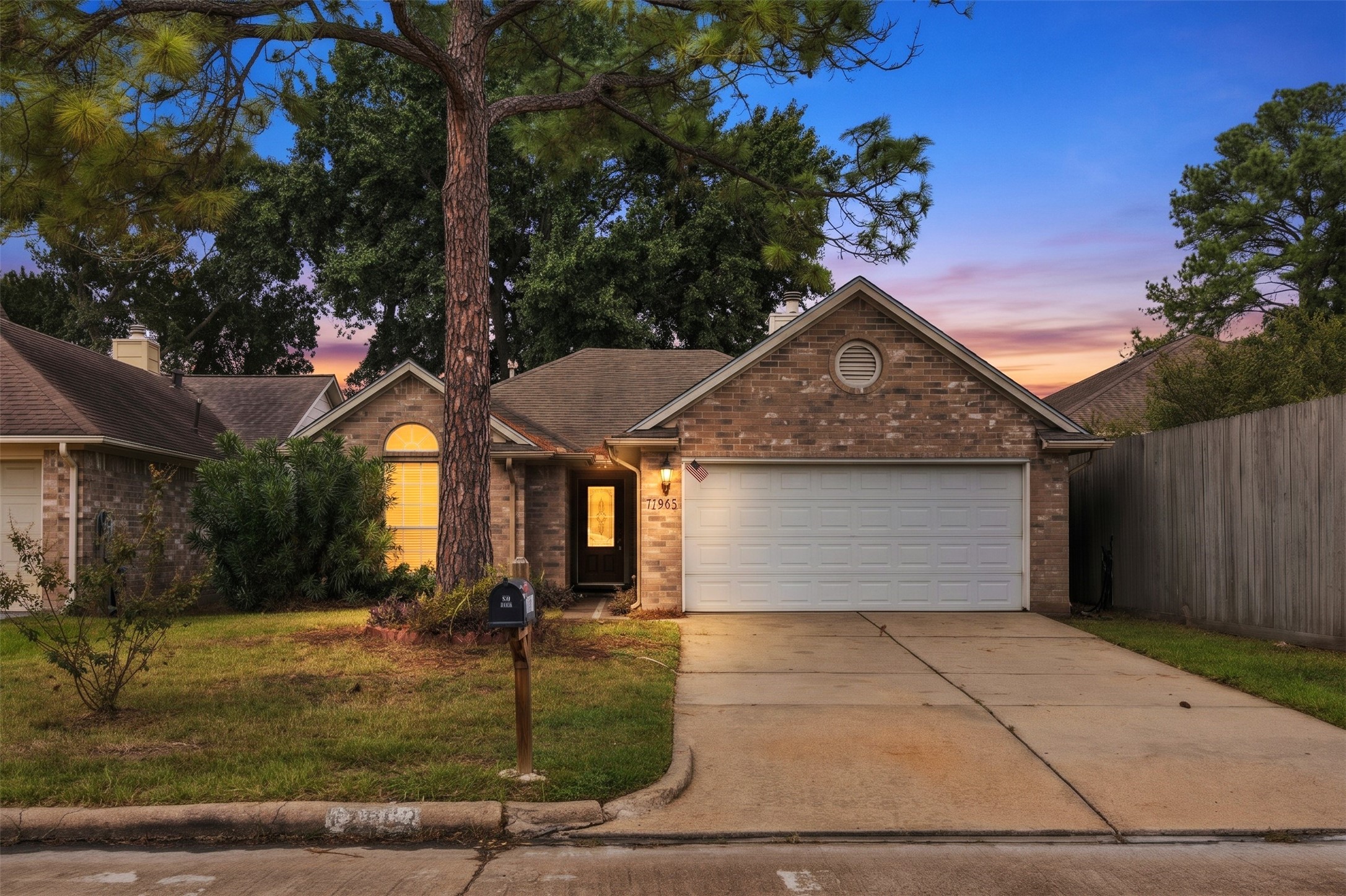 Welcome home to this single-story brick residence with an attached two-car garage and mature trees.