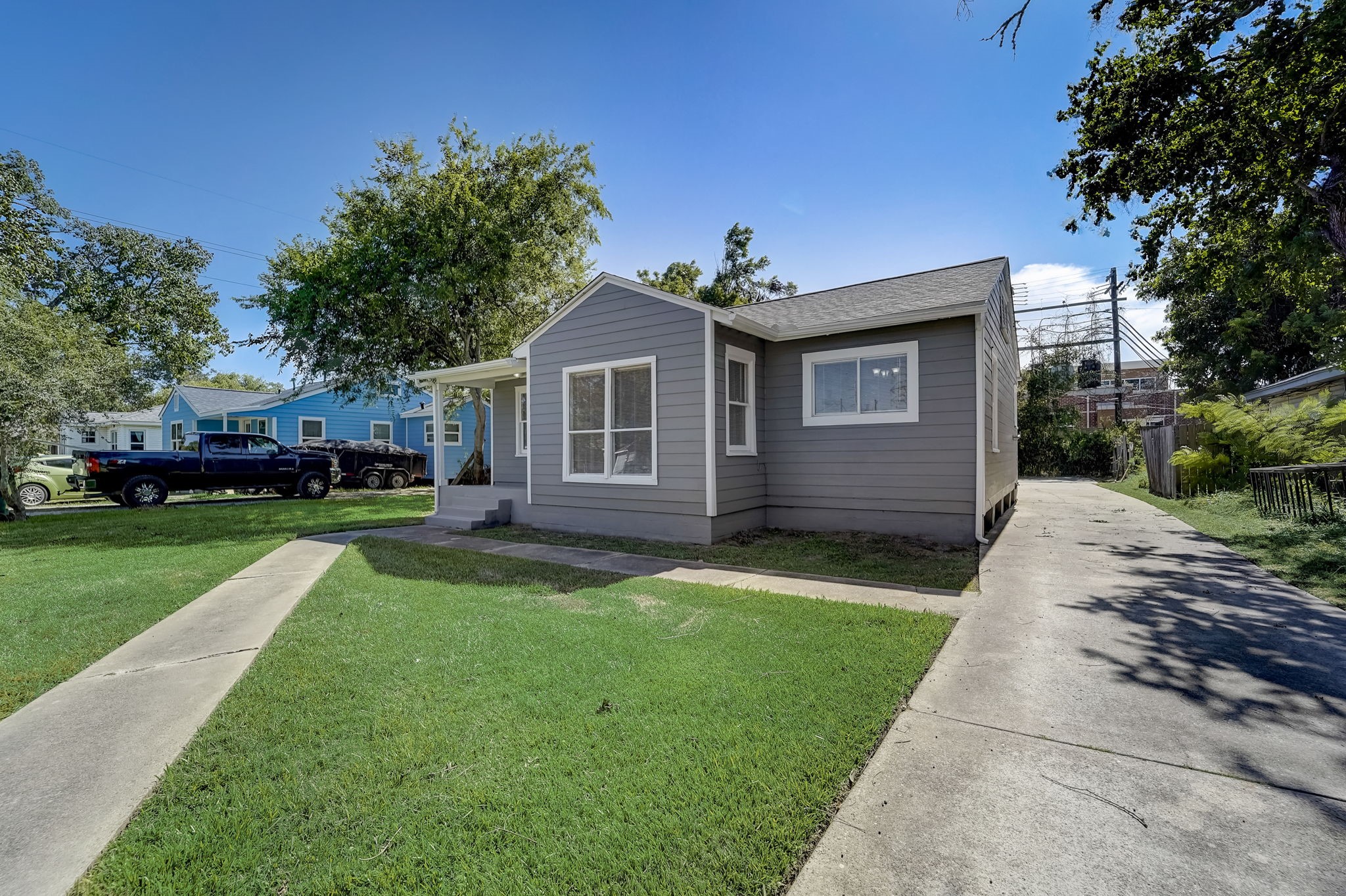 The driveway extends to the back of the property allowing for extra parking.