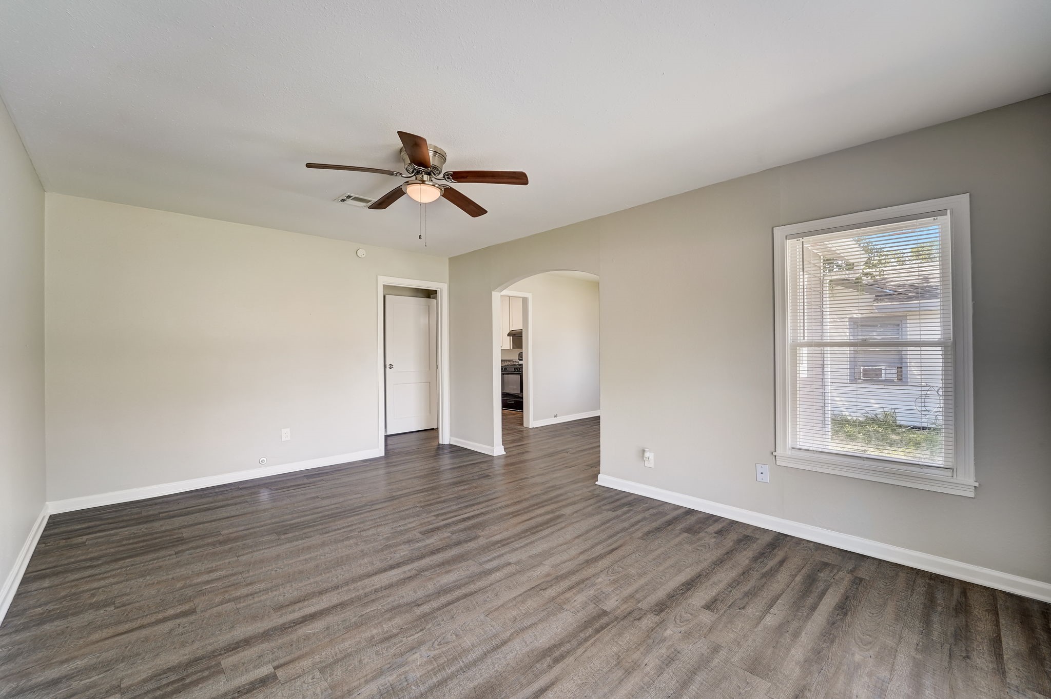 Walk into the bright living room, vinyl flooring in the main living areas.