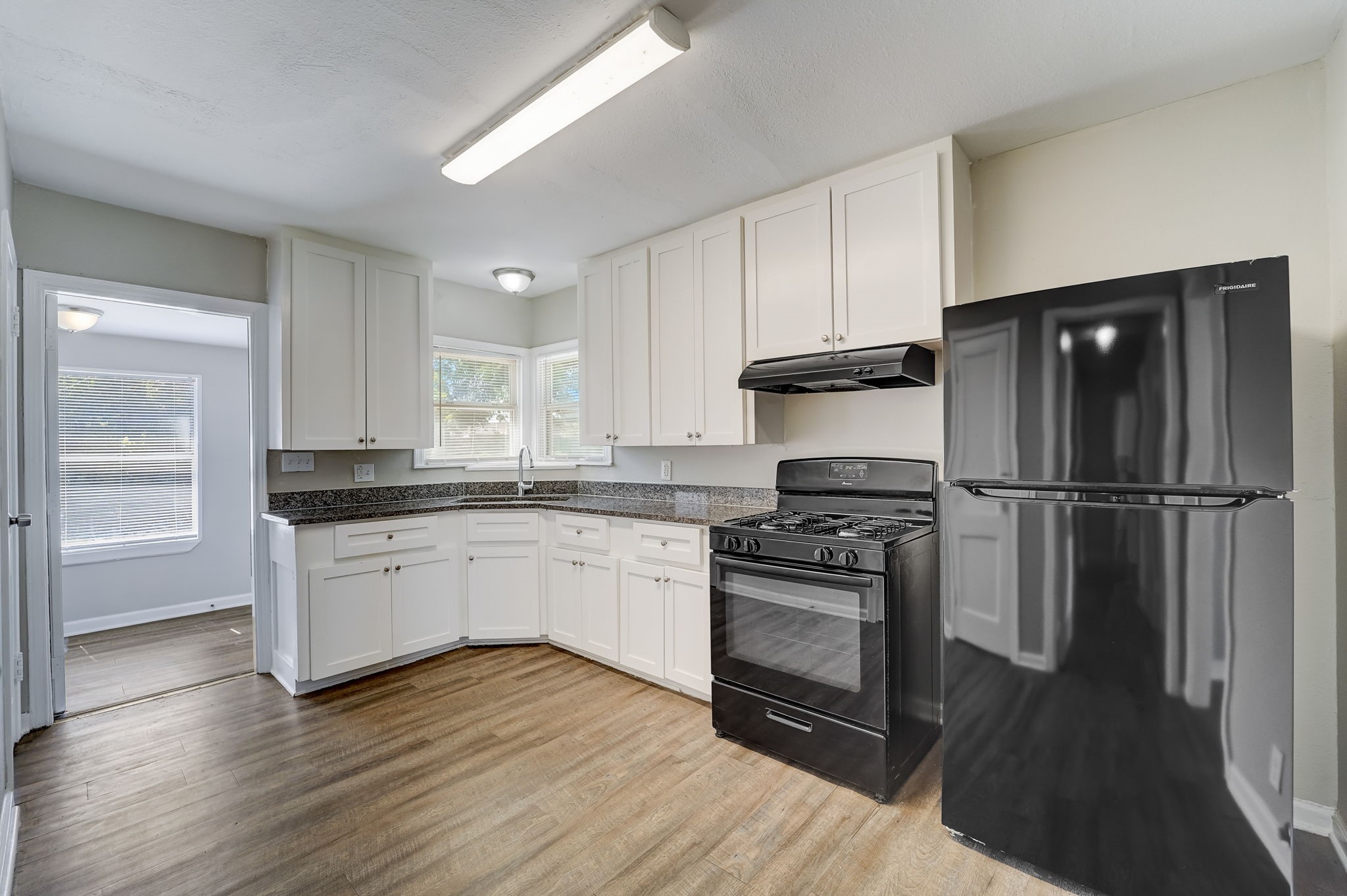 Spacious kitchen space with granite counter tops. Gas range stove and new refrigerator included with lease.