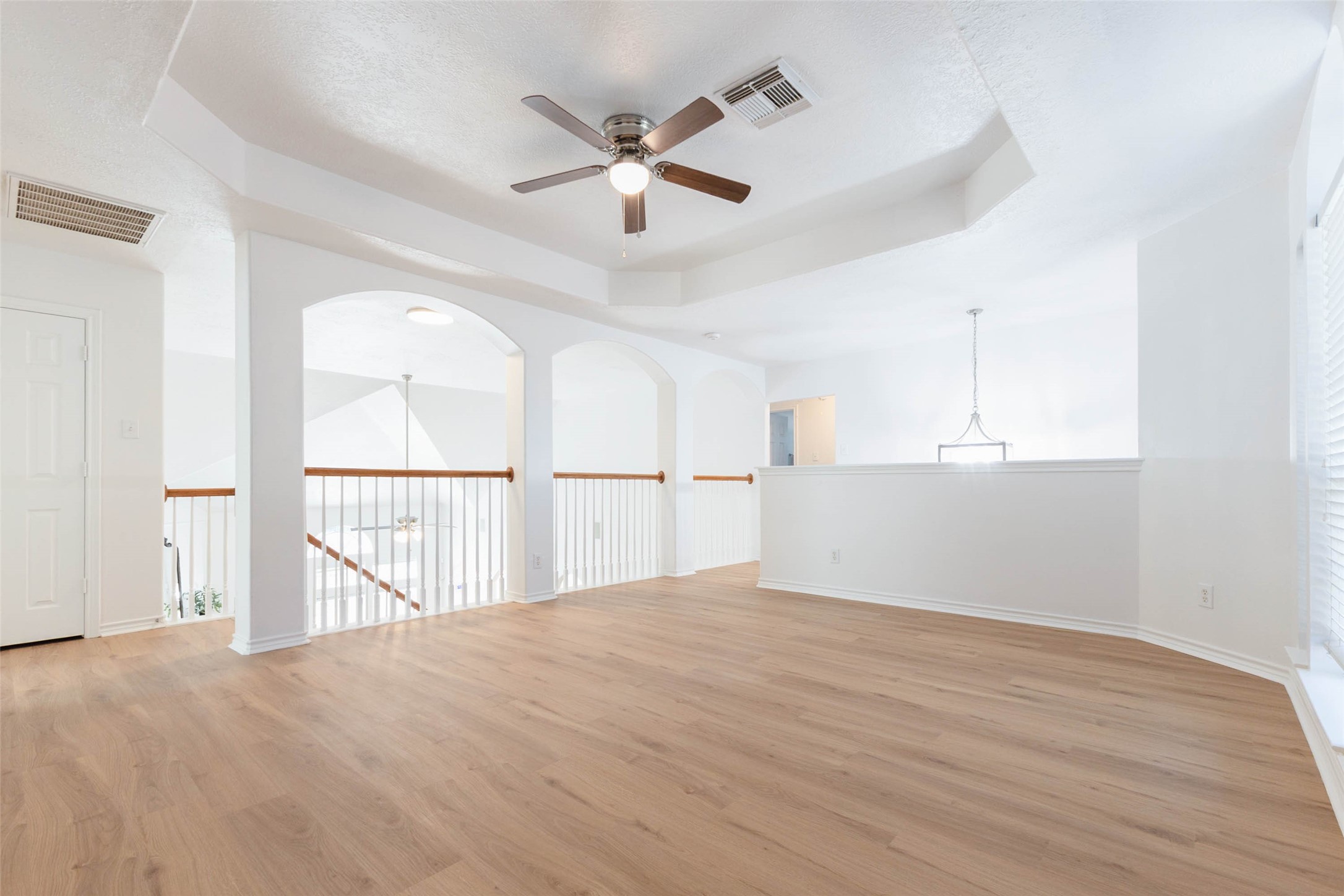 Another perspective of the impressive upstairs game room highlights its generous proportions & versatile layout, offering endless possibilities for a sophisticated media lounge, billiards area, or casual gathering space.