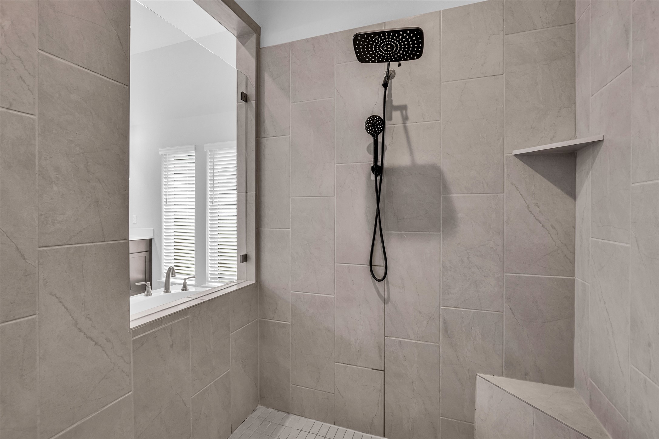 Spacious 7'x6' shower with corner seat