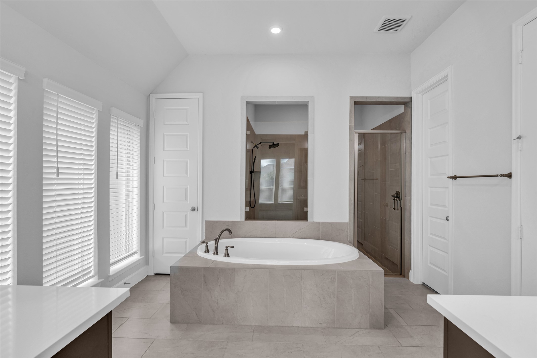 Primary hollywood style bathroom with oversized shower and dual closets