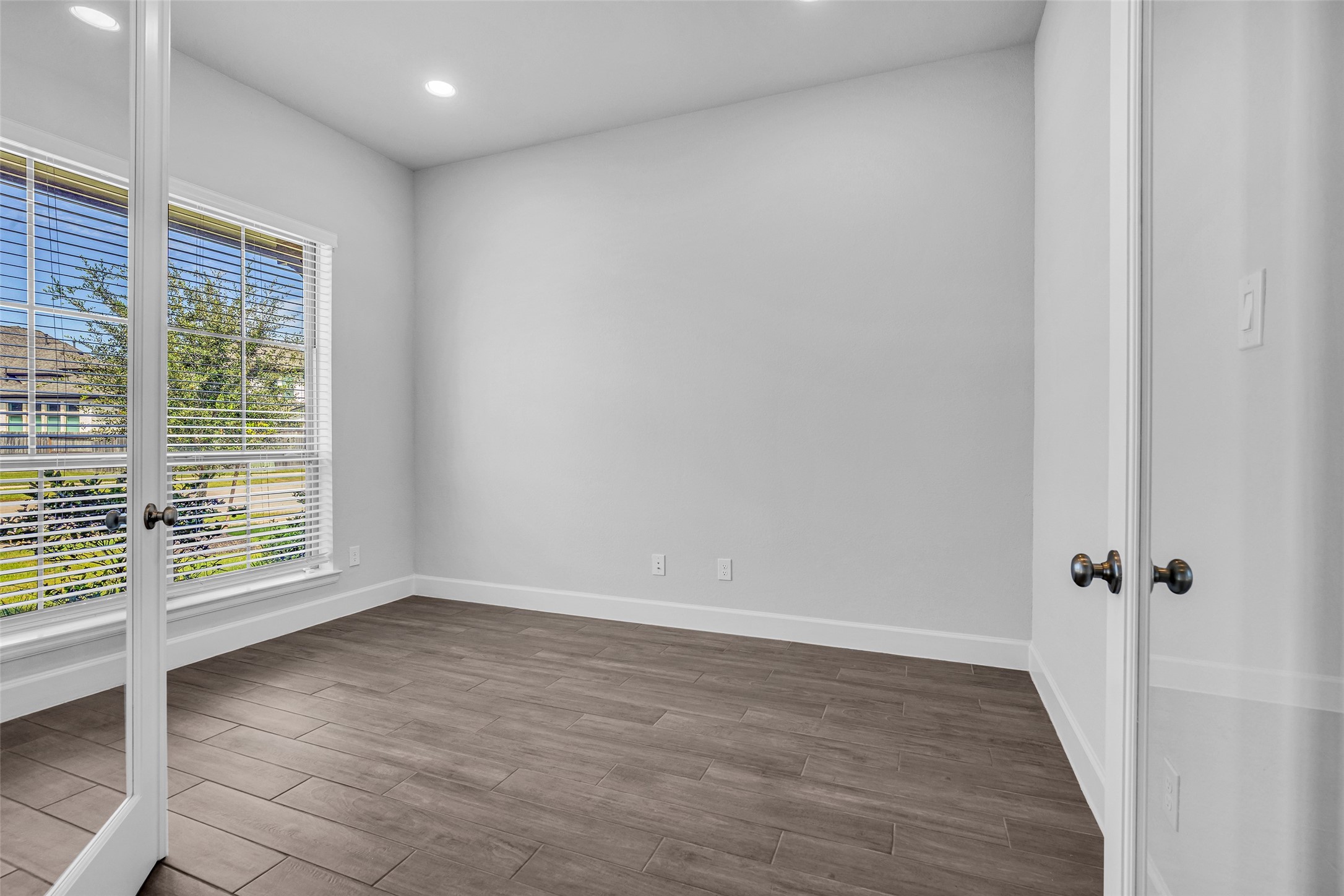 Enclosed den or home office located at the front of the property
