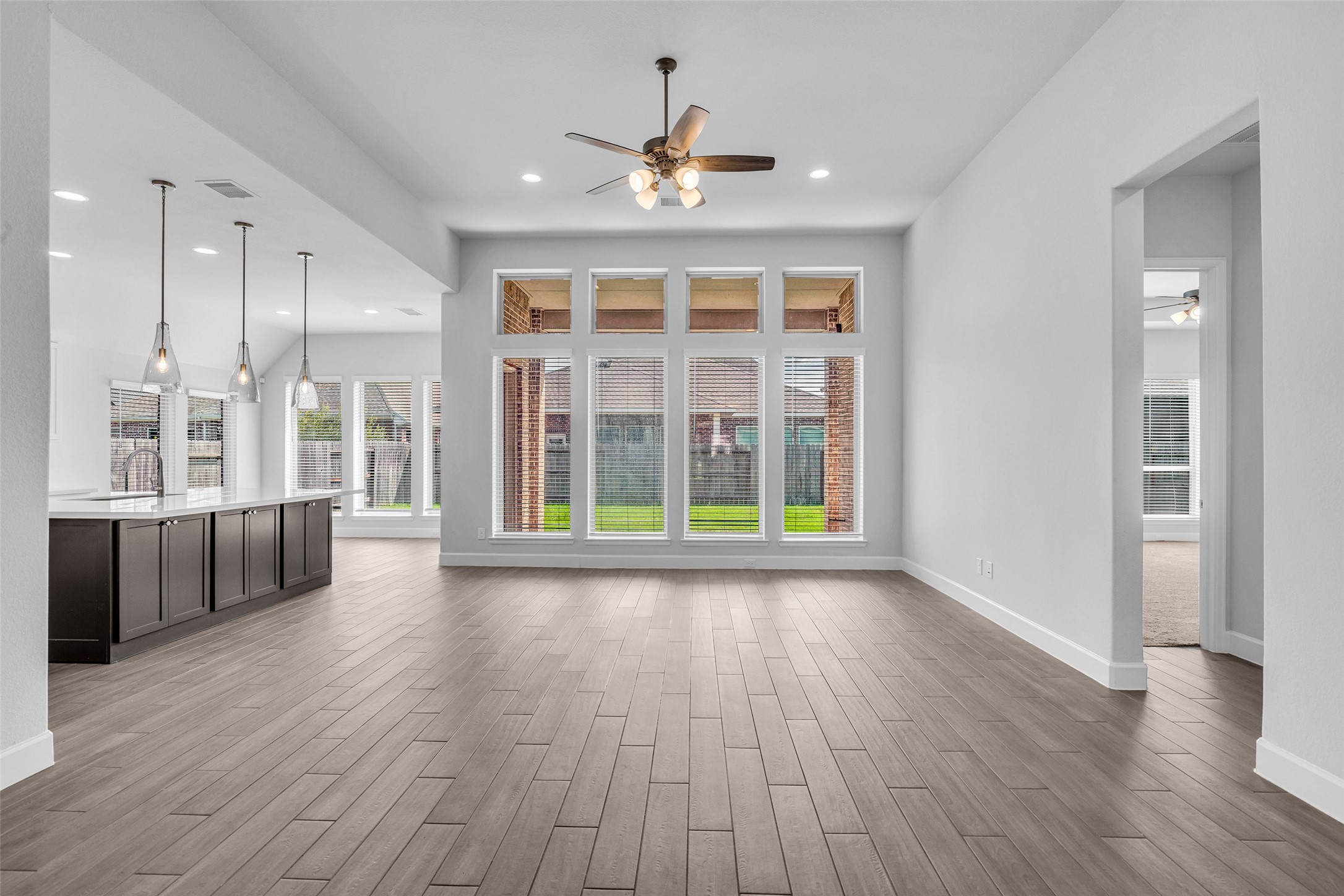 Spacious living room with floor to ceiling windows