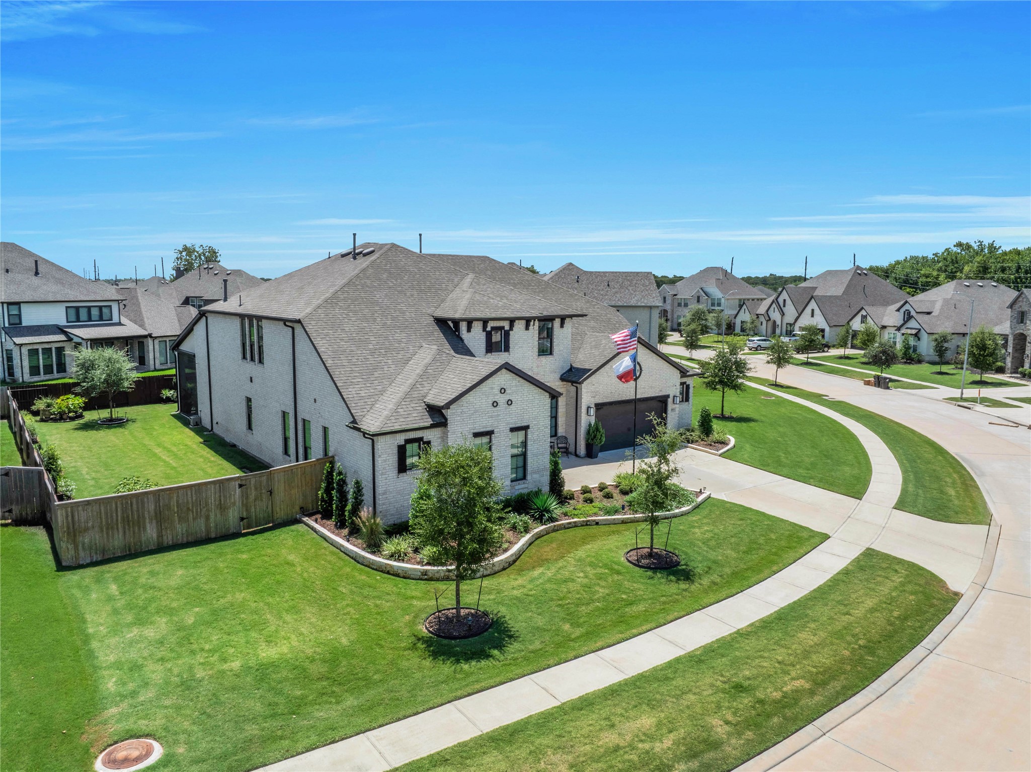 The prime 14,000-square-foot lot curves around the bend, creating an extra sense of privacy and separation from neighboring homes.