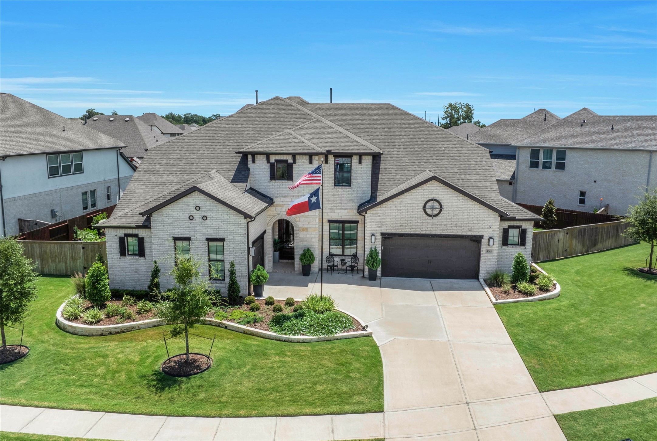 The brick and stone elevation, paired with beautifully manicured landscaping, gives this home exceptional curb appeal from the moment you arrive.